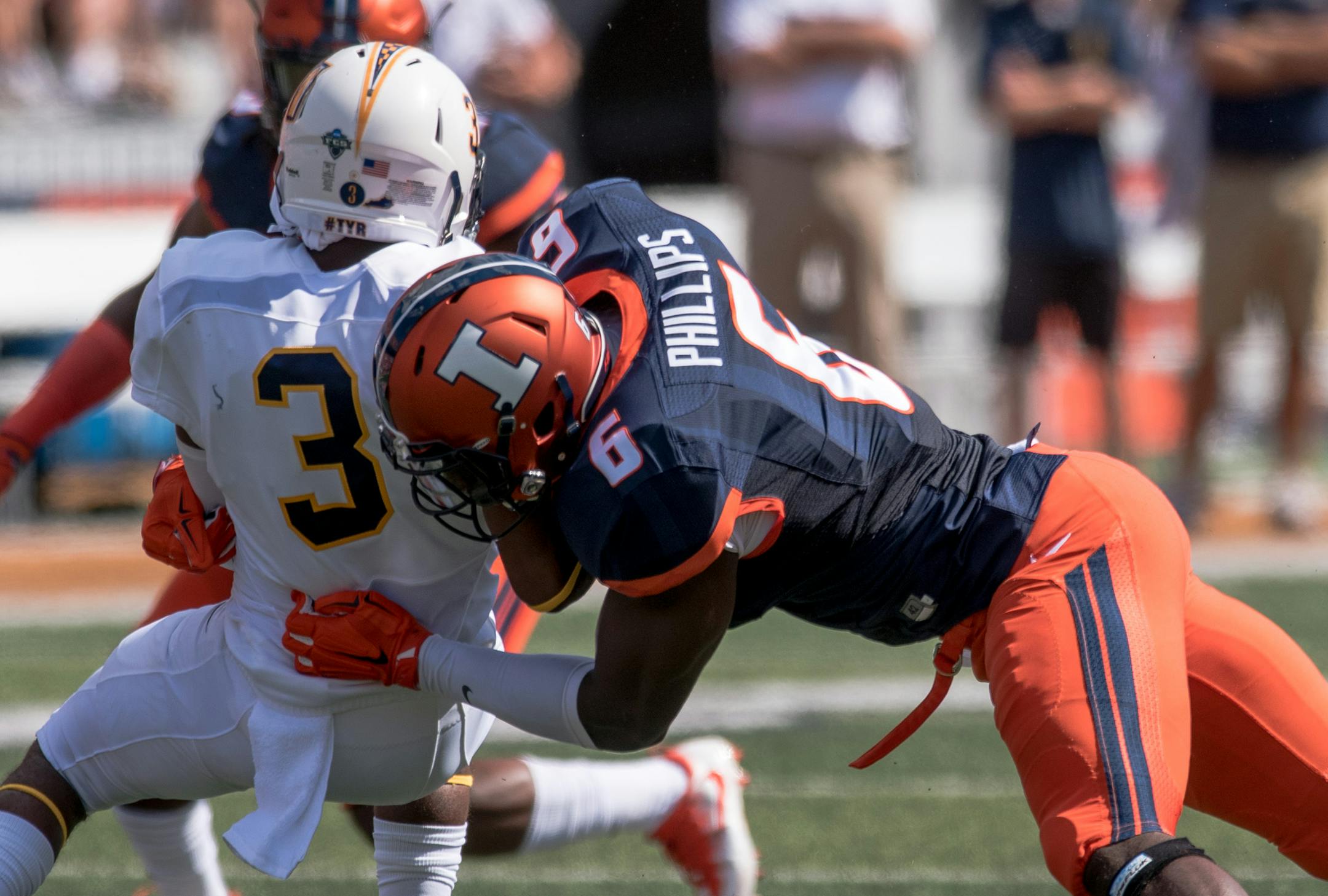 Illinois defensive lineman Carroll Phillips (6) tackles Murray State wide receiver L.J. Gainey (3) during during the first quarter of an NCAA college football game Saturday, Sept. 3, 2016 at Memorial Stadium in Champaign, Ill. (AP Photo/Bradley Leeb) ORG XMIT: ILBL114