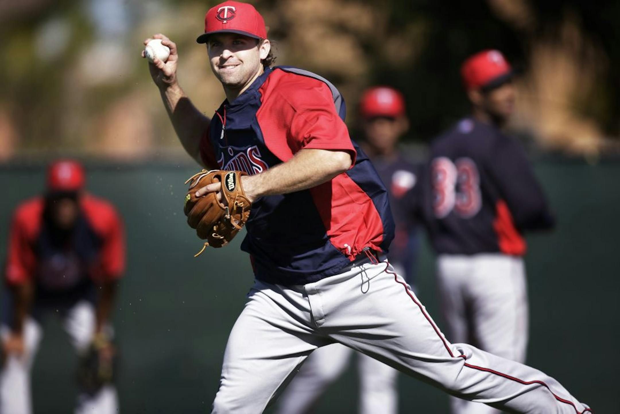 Twins infielder Brian Dozier rain drills during spring training practice Feb.18, 2013 in Fort Myers, FL.