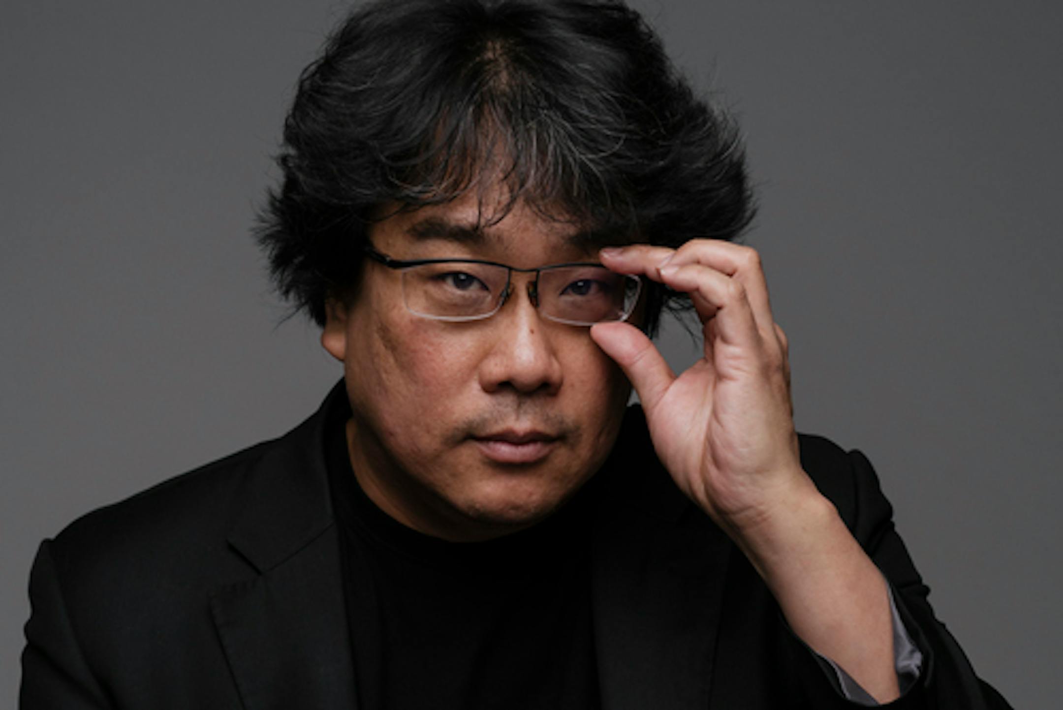 Bong Joon Ho, whose latest film, "Parasite," is finding a wide audience after winning the top prize at Cannes, in Los Angeles, Oct. 27, 2019. You could say that Bong uses blockbuster means to advance art-house ends. You could also say the opposite. His real achievement, though, is to scramble such facile distinctions, A.O. Scott writes. (Philip Cheung/The New York Times)