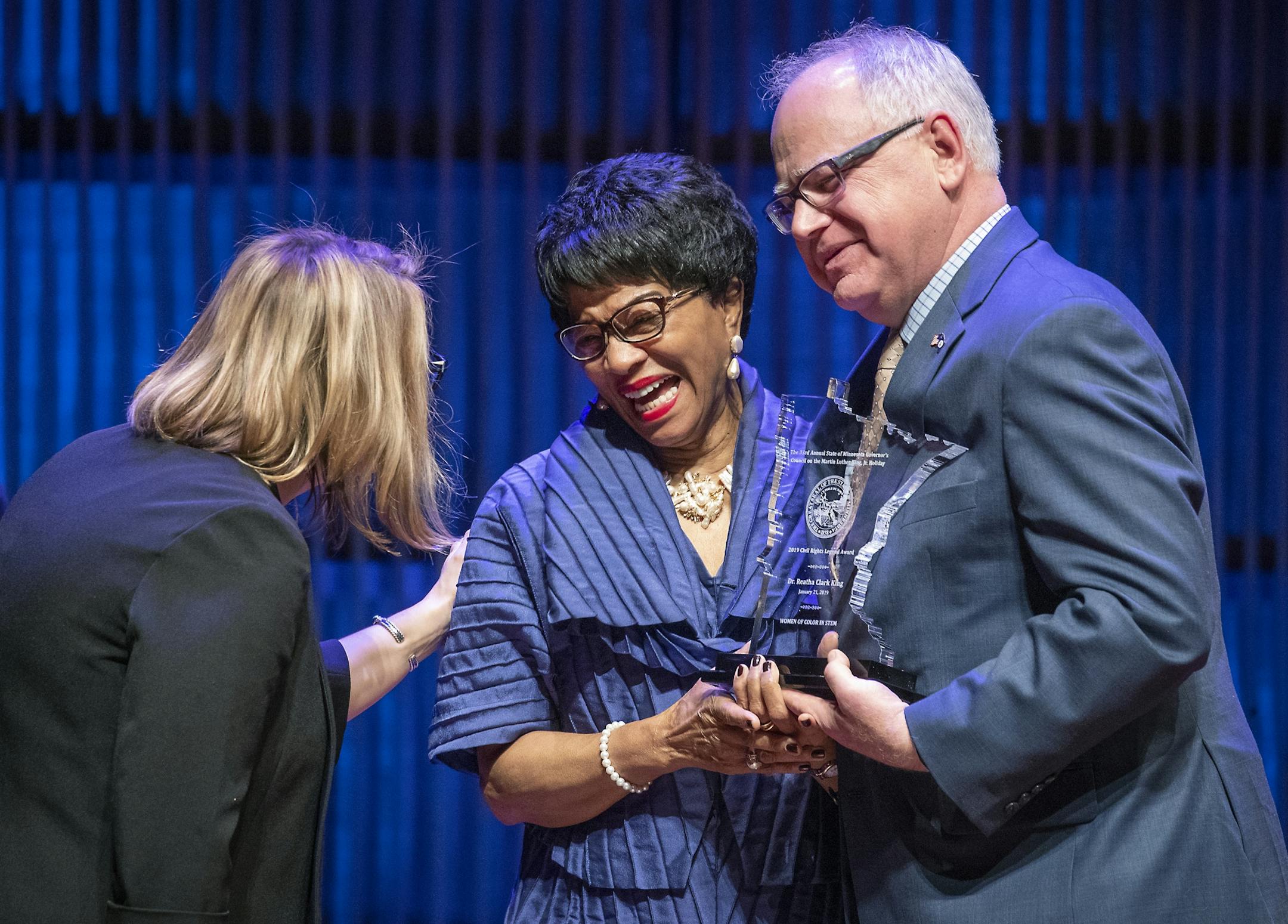 Governor Tim Walz, right, and Lt. Governor Peggy Flanagan, left, presented the 2019 Governor's Civil Rights Legend Award to Dr. Reatha Clark King during the Martin Luther King, Jr. Holiday "Women of Color in STEM" celebration at the Ordway Theatre, Monday, January 21, 2019 in St. Paul, MN.