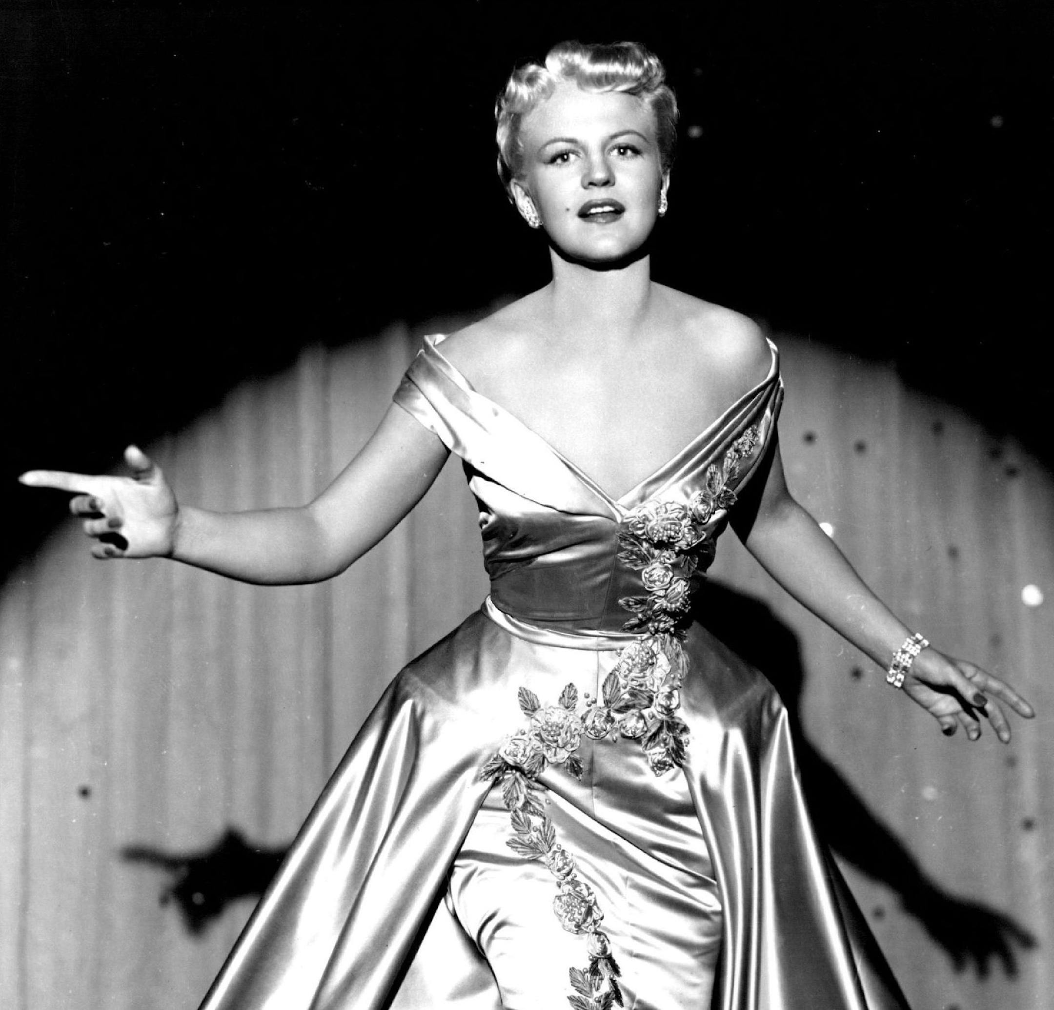 Warner Bros. Presents "The Jazz Singer" . Color By Technicolor. Starring Danny Thomas. Peggy Lee. A Warner Bros. Picture. Warner Bros.