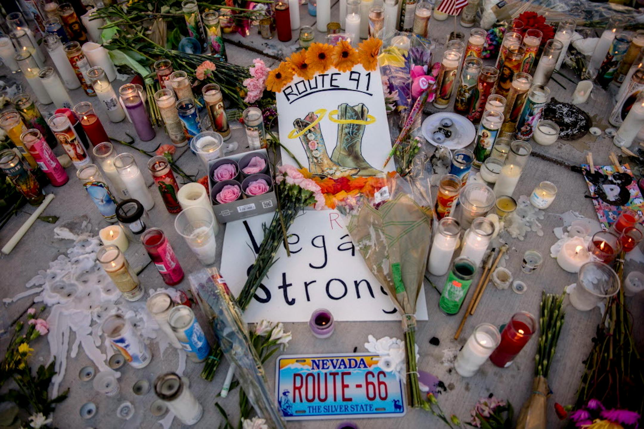 A makeshift memorial to victims of the mass shooting on Sunday night, on the northern end of the Las Vegas strip, Oct. 3, 2017. A lone gunman opened fire from the 32nd floor of the Mandalay Bay Casino and Resort on Sunday night, killing at least 59 and wounding at least 527 more at a country music festival below. (Hilary Swift/The New York Times)