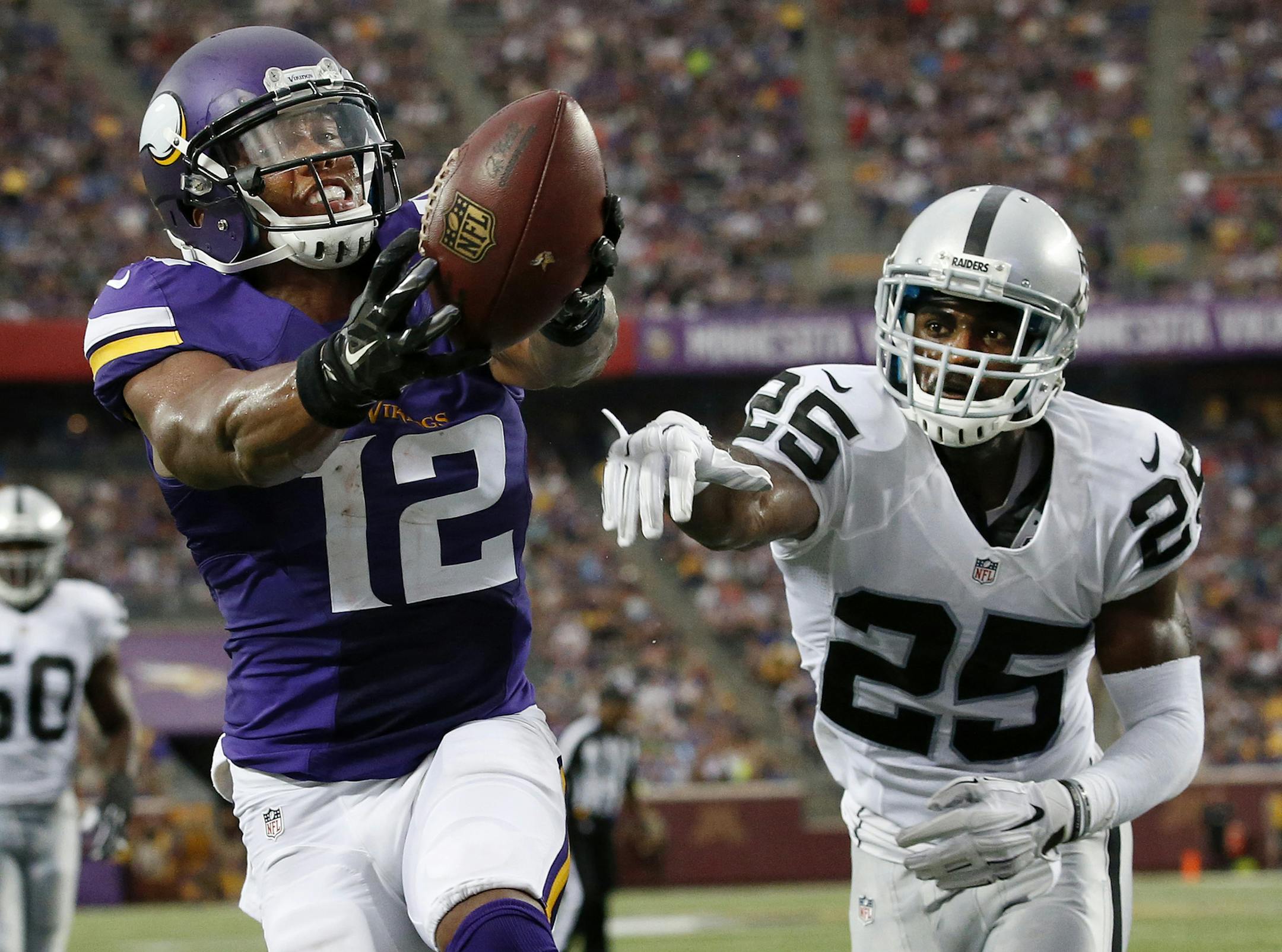 Charles Johnson (12) caught a pass for a touchdown while being defended by DJ Hayden (25) in the second quarter. ] CARLOS GONZALEZ cgonzalez@startribune.com - August 22, 2015, Minneapolis, MN, TCF Bank Stadium, NFL, Minnesota Vikings vs. Oakland Raiders