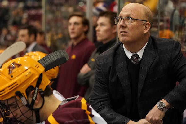 Gophers coach Bob Motzko watched from the bench during a game last month. Minnesota lost Friday night, 3-2 to Notre Dame.