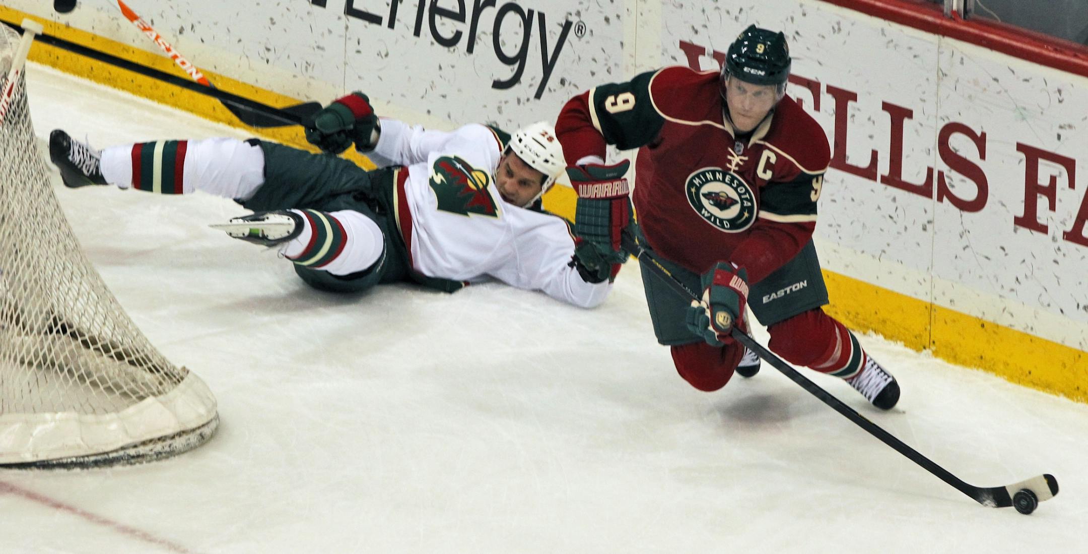 Mikko Koivu took the puck away from Zenon Konopka during the Wild's team scrimmage.