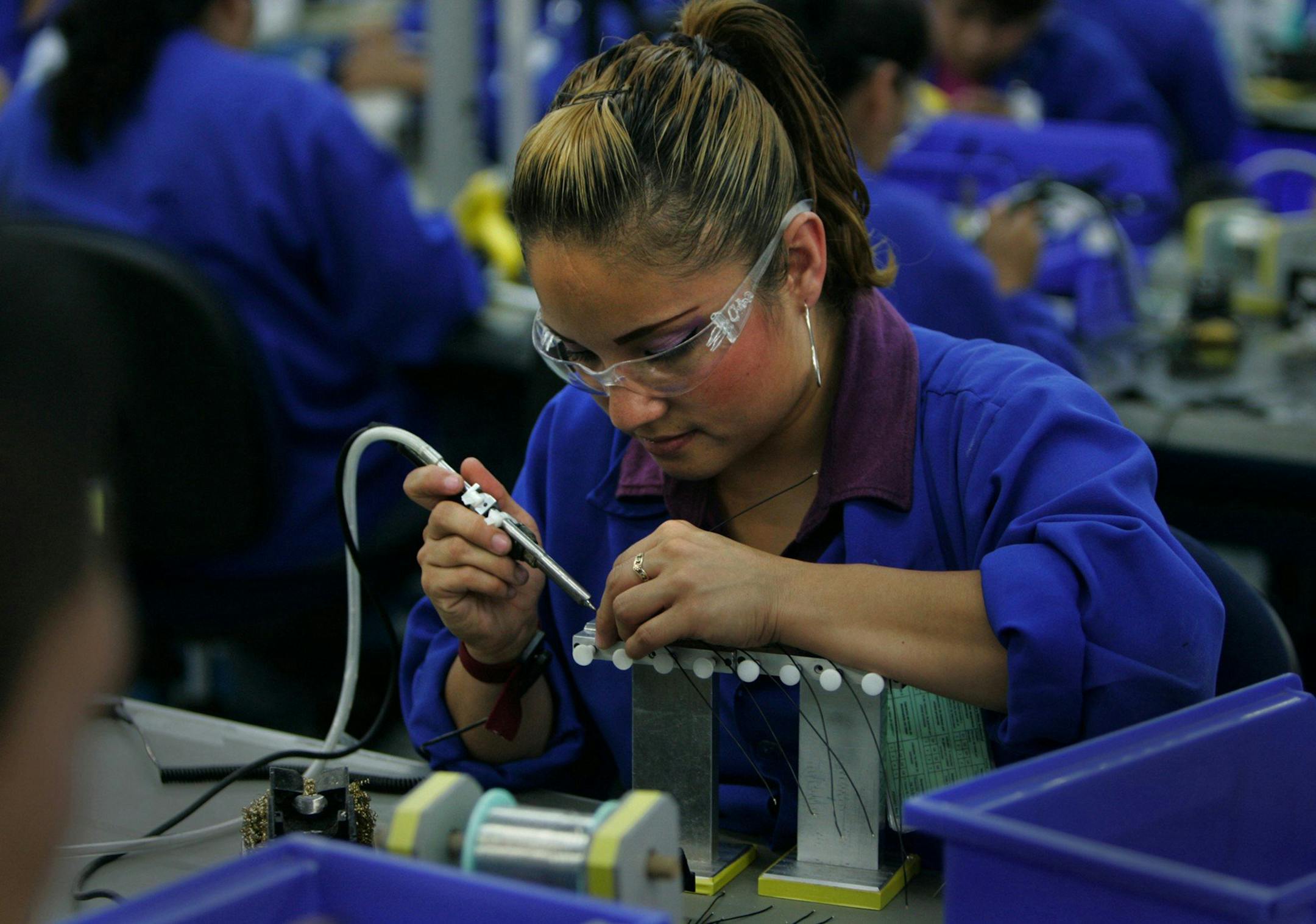 Communication headsets are made at Plantronics, a maquiladora in Tijuana, Mexico. (Peggy Peattie/San Diego Union-Tribune/TNS) ORG XMIT: 1195809