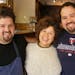 Mom Lupe hugs chef sons Mike Brown, left, and Matt Brown, right. Mike helped Matt cook after Matt's daughter got cancer.