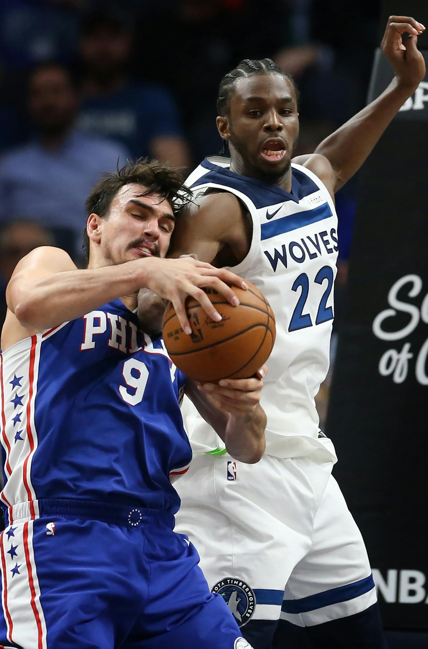 Minnesota Timberwolves forward Andrew Wiggins (22) and Philadelphia 76ers forward Dario Saric (9) battled for a loose ball during NBA action at Target Center Tuesday December 12, 2017 in Minneapolis, MN.] The Minnesota Timberwolves hosted the Philadelphia 76ers at Target Center. JERRY HOLT &#xef; jerry.holt@startribune.com