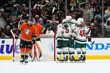 Wild players celebrated a goal by Joseph Cramarossa during Wednesday’s game in Anaheim.