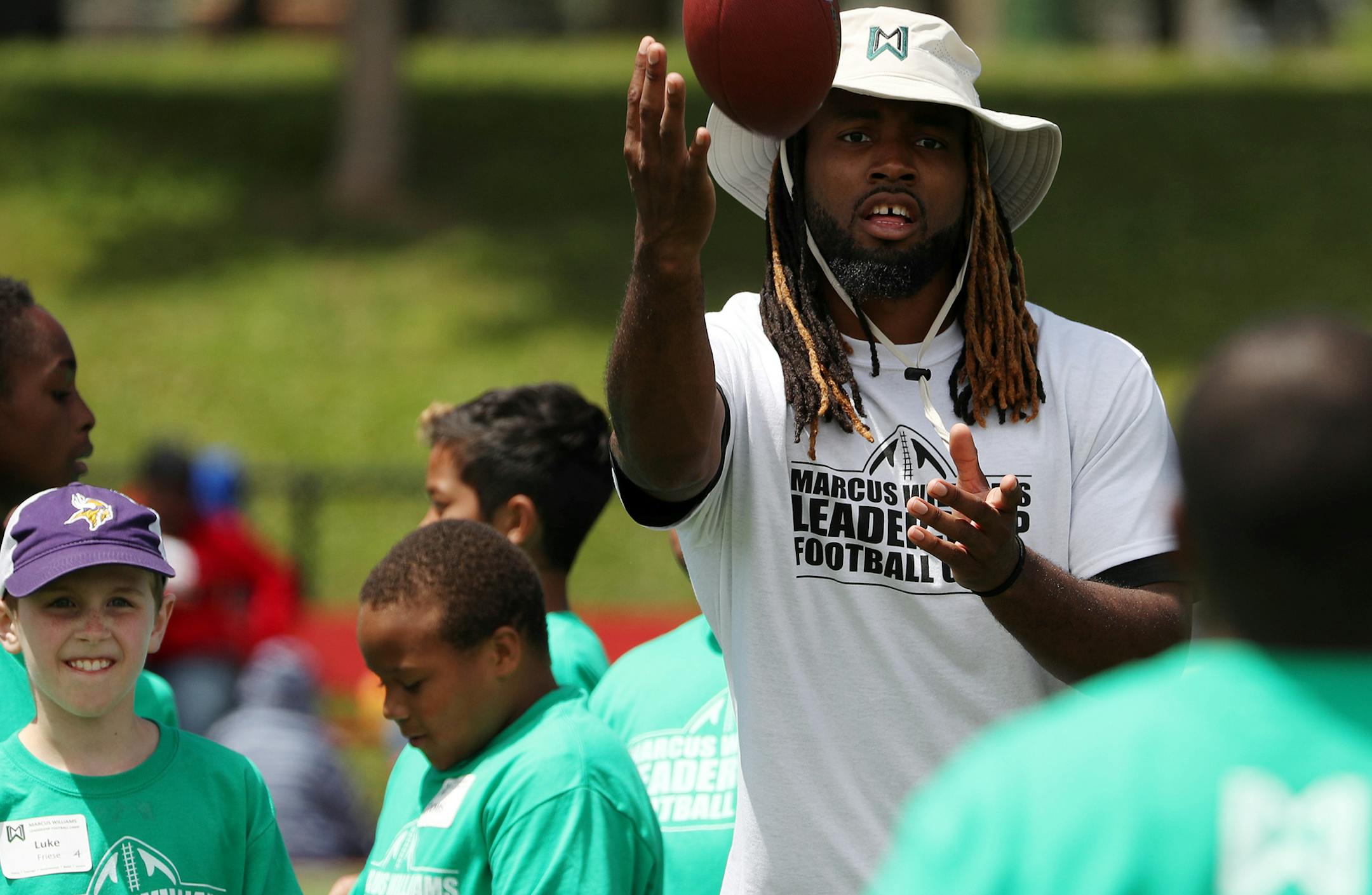 New York Jets cornerback Marcus Williams led a drill during his annual summer football camp for kids Saturday. ] ANTHONY SOUFFLE &#xef; anthony.souffle@startribune.com New York Jets cornerback Marcus Williams, who is from Minnesota, taught at his annual football camp for kids Saturday, June 24, 2017 at Fairview Park in north Minneapolis.