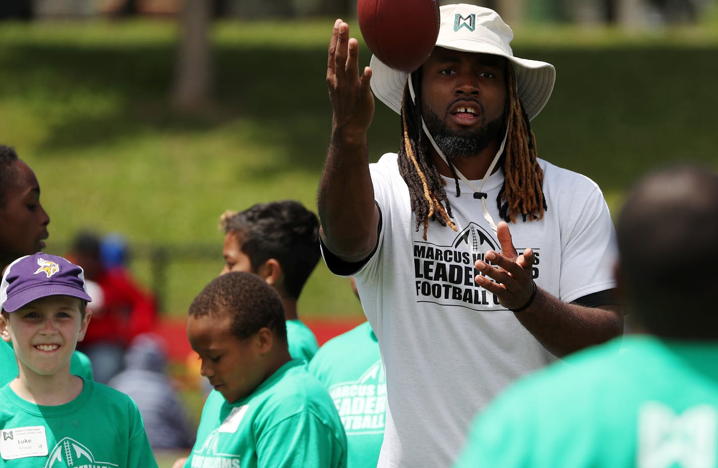 New York Jets cornerback Marcus Williams led a drill during his annual summer football camp for kids Saturday. ] ANTHONY SOUFFLE &#xef; anthony.souffle@startribune.com New York Jets cornerback Marcus Williams, who is from Minnesota, taught at his annual football camp for kids Saturday, June 24, 2017 at Fairview Park in north Minneapolis.