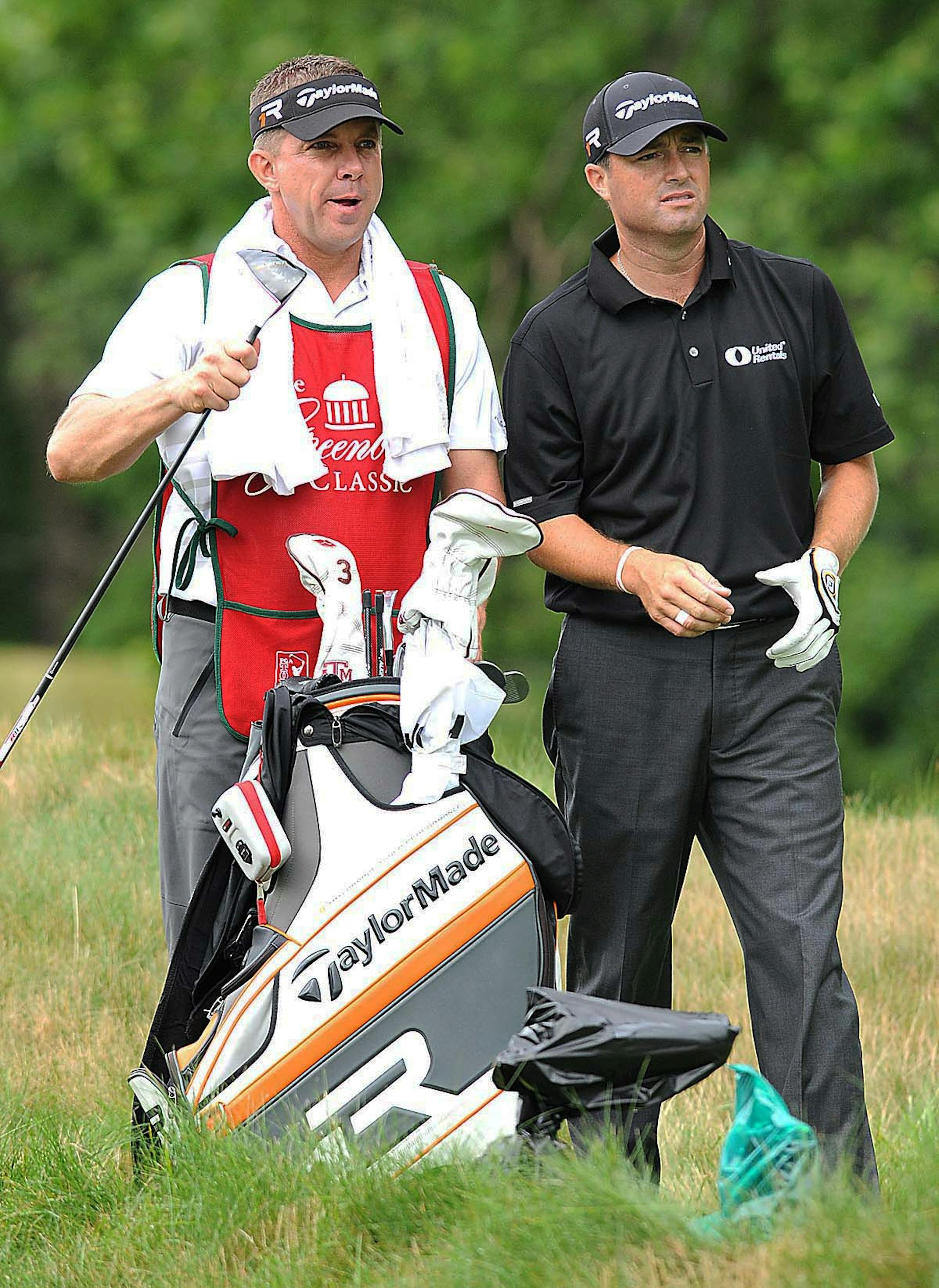 New Orleans Saints coach Sean Payton, left, caddied for Ryan Palmer during the pro-am for the Greenbrier Classic in White Sulphur Springs, W. Va., on Wednesday.