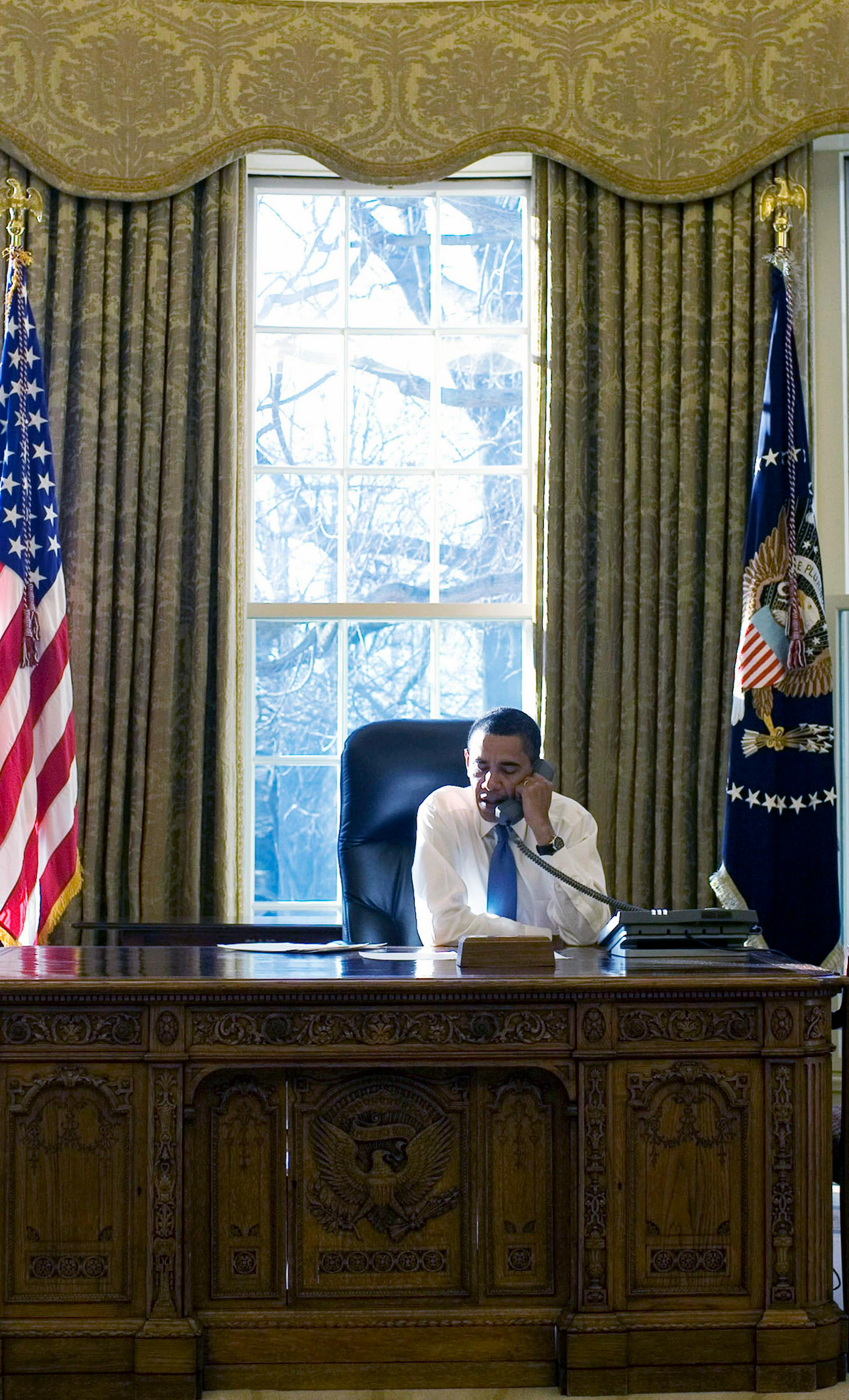 President Barack Obama at his desk in the Oval office of the White House, in Washington, Wednesday, Jan. 21, 2009. The photo was released by the White House. Wednesday was Obama's first full day as president. (Pete Souza/The White House via The New York Times) EDITORIAL USE ONLY
