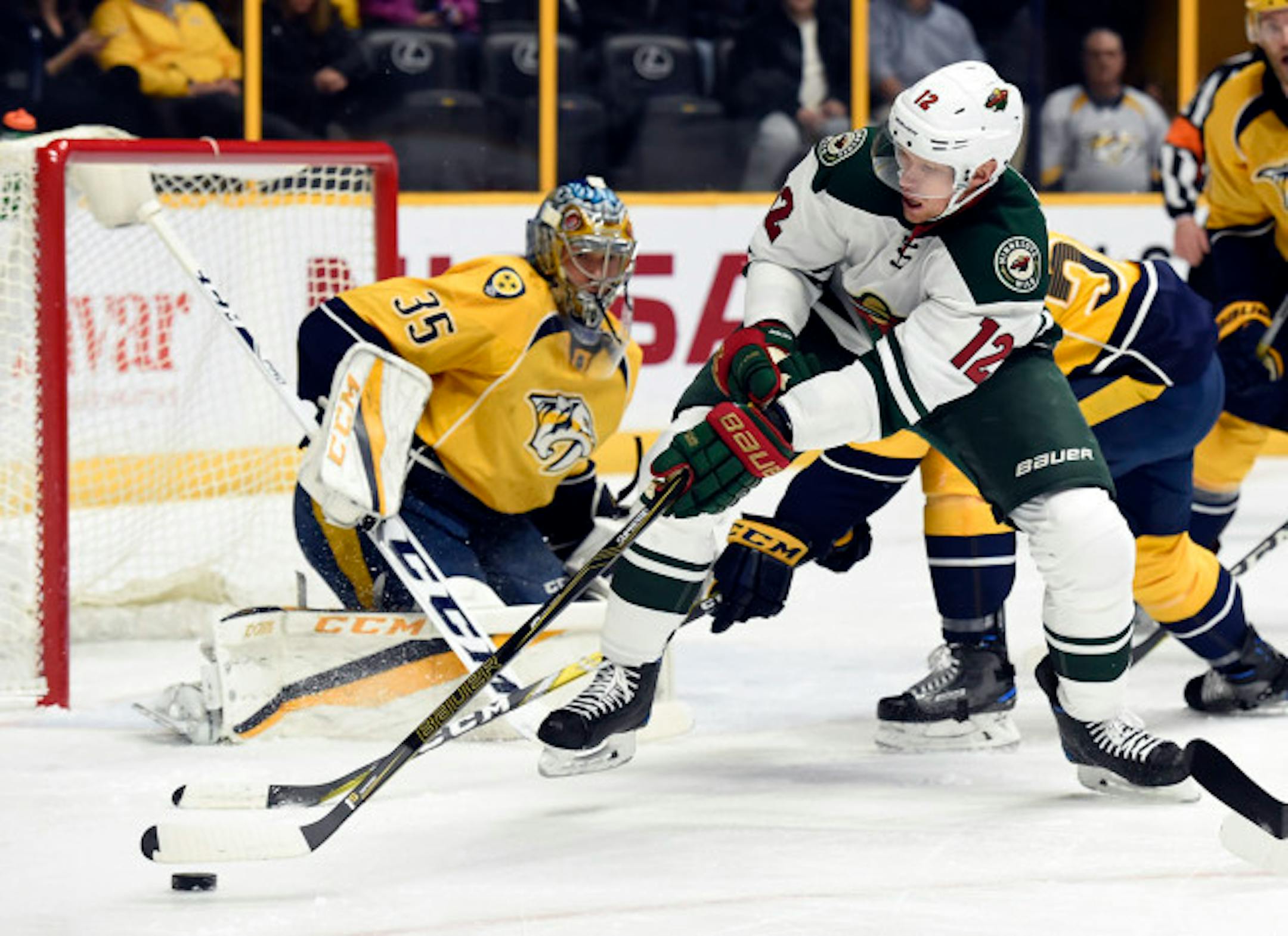 Minnesota Wild center Eric Staal (12) maneuvers the puck in front of Nashville Predators goalie Pekka Rinne (35), of Finland, during the first period of an NHL hockey game Tuesday, Dec. 27, 2016, in Nashville, Tenn.
