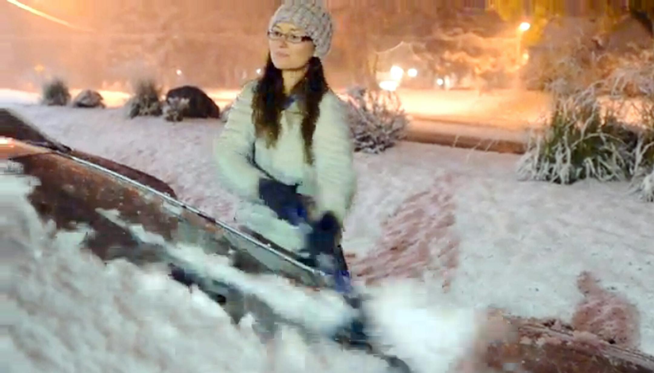 Sherry Zimmermann of Maple Plain said she wasn't quite ready for winter as the first snow of the season fell Tuesday night, Nov. 5, 2013.