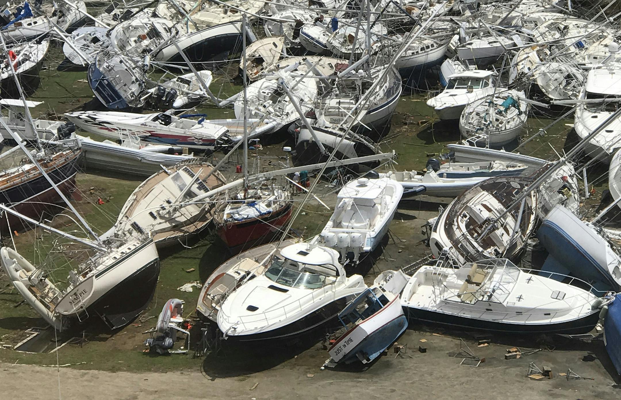 This Sept. 14, 2017 photo provided by Guillermo Houwer on Saturday, Sept. 16, shows some damaged boats at the Virgin Gorda Yacht Harbour in the aftermath of Hurricane Irma on Virgin Gorda, in the British Virgin Islands. (Guillermo Houwer via AP)