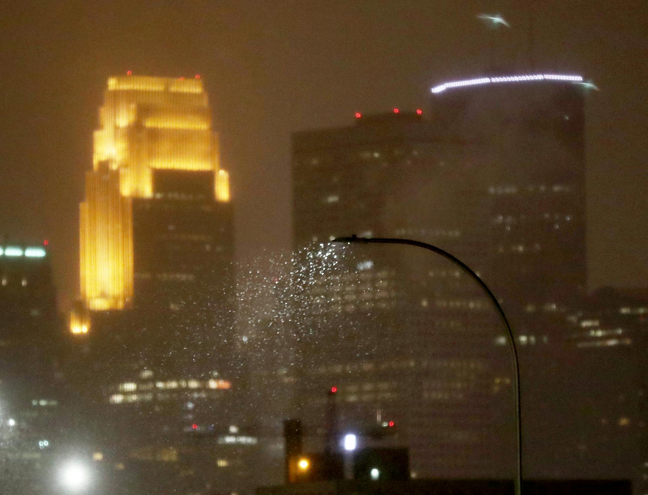 Snow is seen beginning to fall near Broadway Ave. S. and I-94 Thursday, Jan 11, 2018, in Minneapolis, MN.