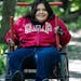 Maria Schmidt tries out the all-terrain wheelchair available at the Wood Lake Nature Center in Richfield. 