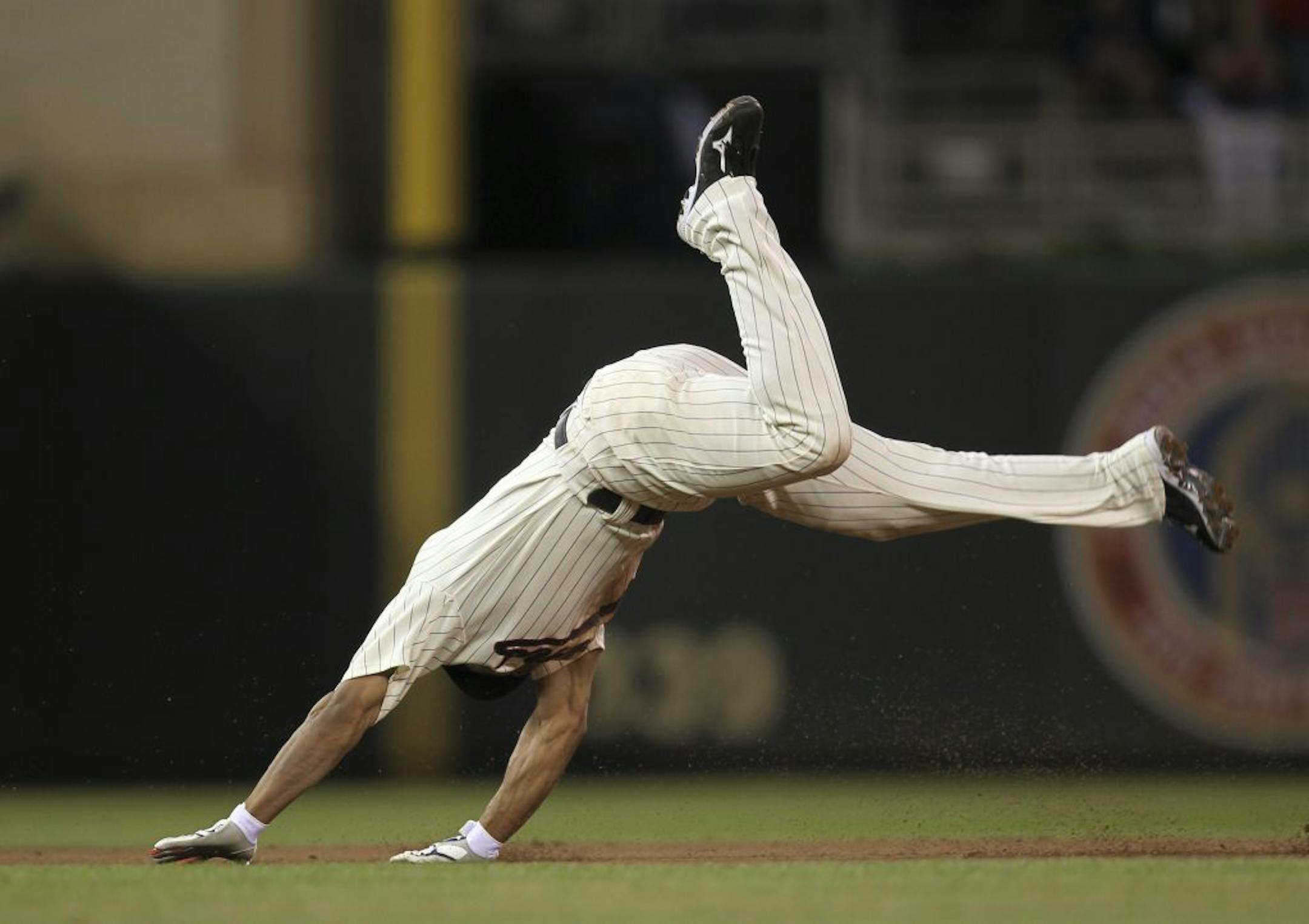 The Twins' Ben Revere motored - and somersaulted - his way to a triple with his hit to deep right in the sixth inning. Rain delayed the start of the Minnesota Twins game against the Kansas CIty Royals Friday night, July 15, 2011 at Target Field in Minneapolis, Minn.
