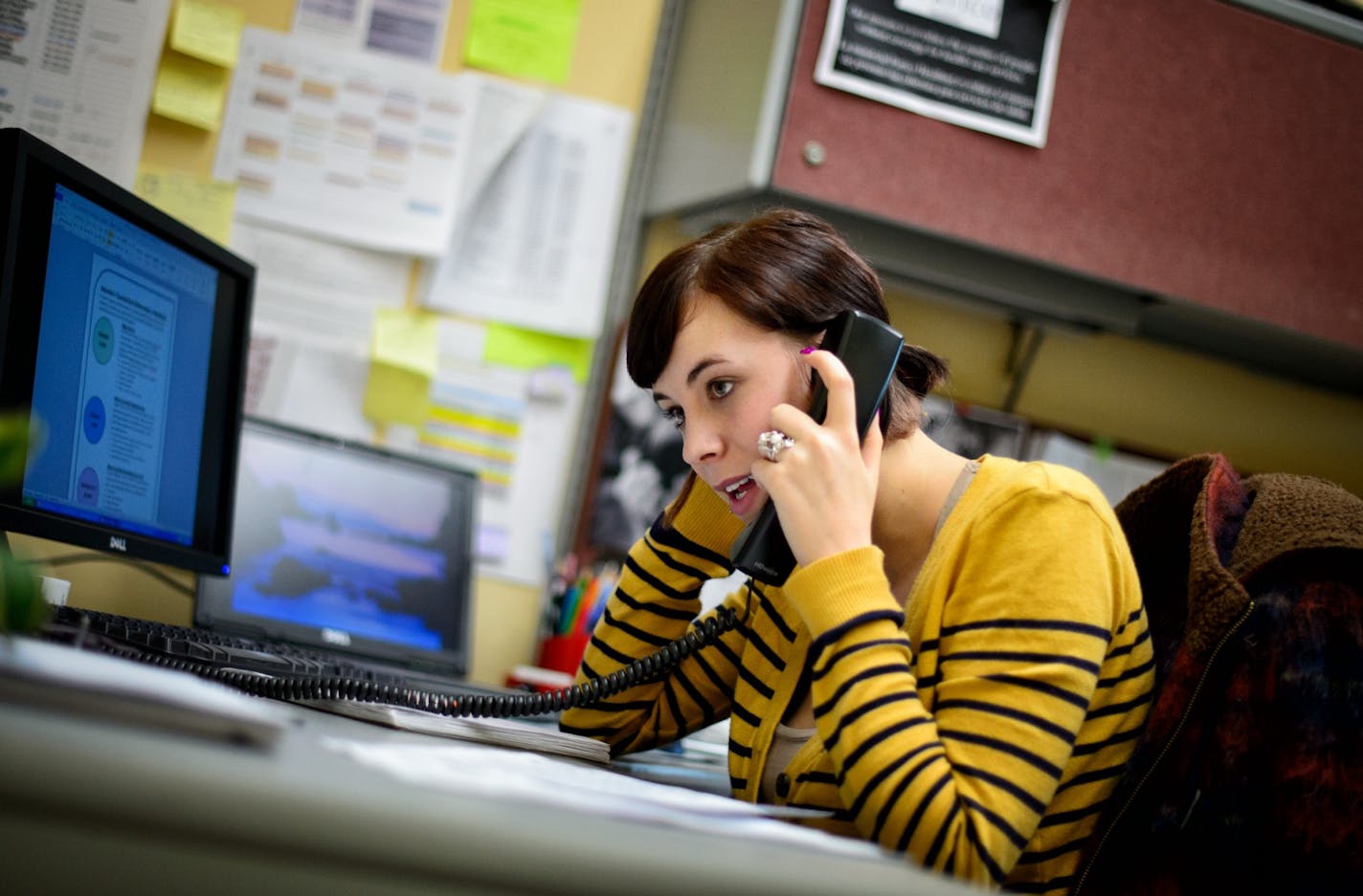 Portico navigator Victoria Quiroz worked with a client on the phone, Wednesday, Oct. 16, 2013. Portico has been working since 1995 to help low-income people get publicly funded health care through programs like Medicaid and MinnesotaCare.