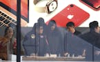 Customers visit an Apple store in Beijing, China, Thursday, Jan. 3, 2019. Apple Inc.&#x2019;s $1,000 iPhone is a tough sell to Chinese consumers who a
