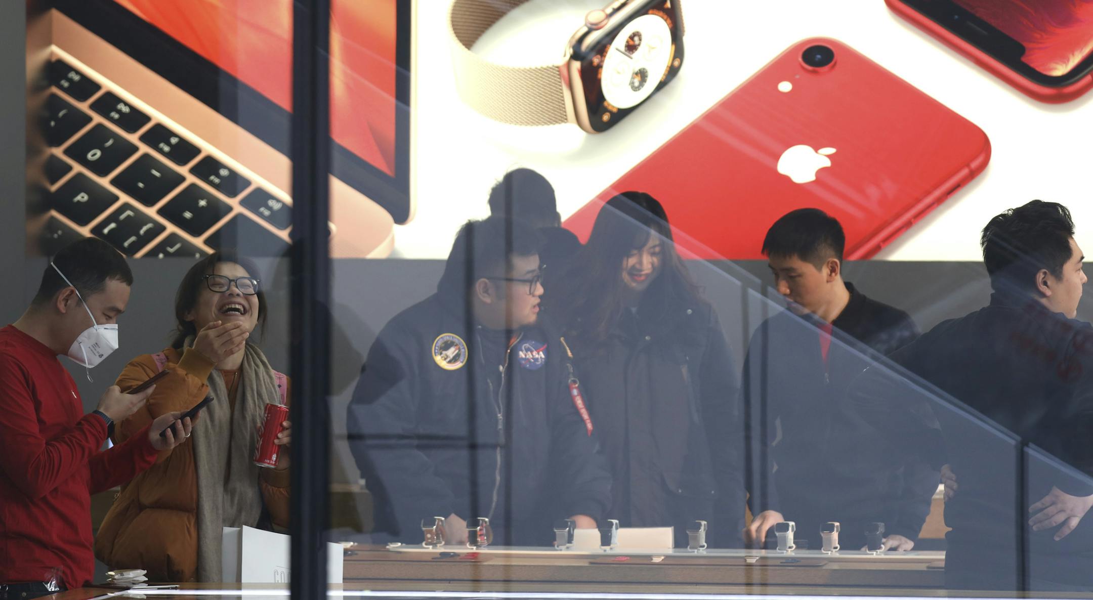 Customers visit an Apple store in Beijing, China, Thursday, Jan. 3, 2019. Apple Inc.&#x2019;s $1,000 iPhone is a tough sell to Chinese consumers who are jittery over an economic slump and a trade war with Washington. The tech giant became the latest global company to collide with Chinese consumer anxiety when CEO Tim Cook said iPhone demand is waning, due mostly to China. Weak consumer demand in the world&#x2019;s second-largest economy is a blow to industries from autos to designer clothing tha