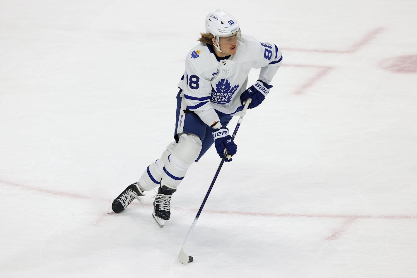 Toronto Maple Leafs right wing William Nylander (88) handles the puck against the Minnesota Wild during the first period of an NHL hockey game Friday, Nov. 25, 2022, in St. Paul, Minn. (AP Photo/Stacy Bengs)