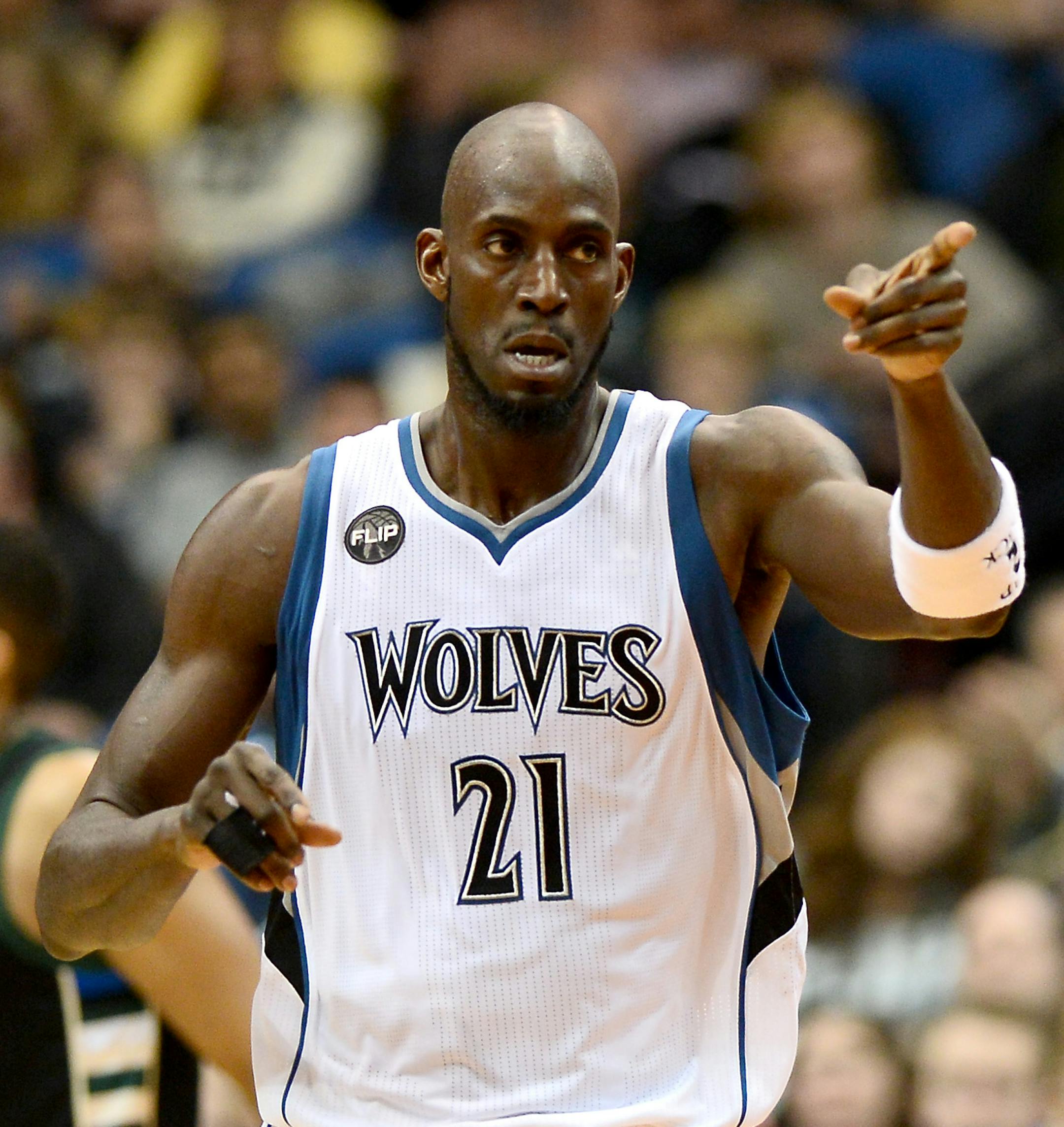 Minnesota Timberwolves forward Kevin Garnett (21) gestured to guard Andrew Wiggins (22) after Wiggins hit a 2-point jump shot in the third quarter. ] (AARON LAVINSKY/STAR TRIBUNE) aaron.lavinsky@startribune.com The Minnesota Timberwolves played the Milwaukee Bucks on Saturday, Jan. 2, 2016 at Target Center in Minneapolis, Minn. ORG XMIT: MIN1601022152160183