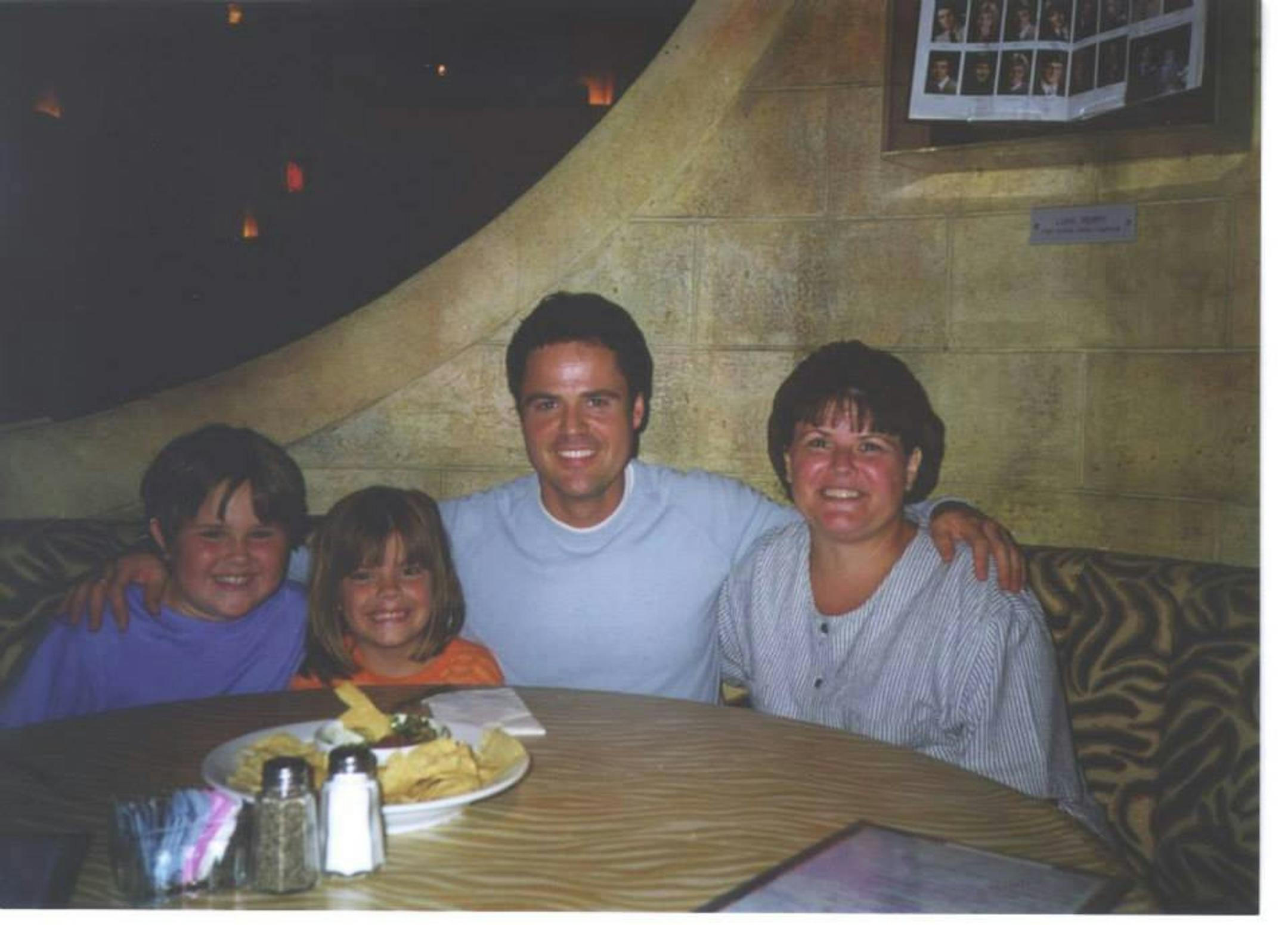 Brenda Van Asch's treasured 15-year-old photo of Donny Osmond with her and her daughters Brianna and Gina.