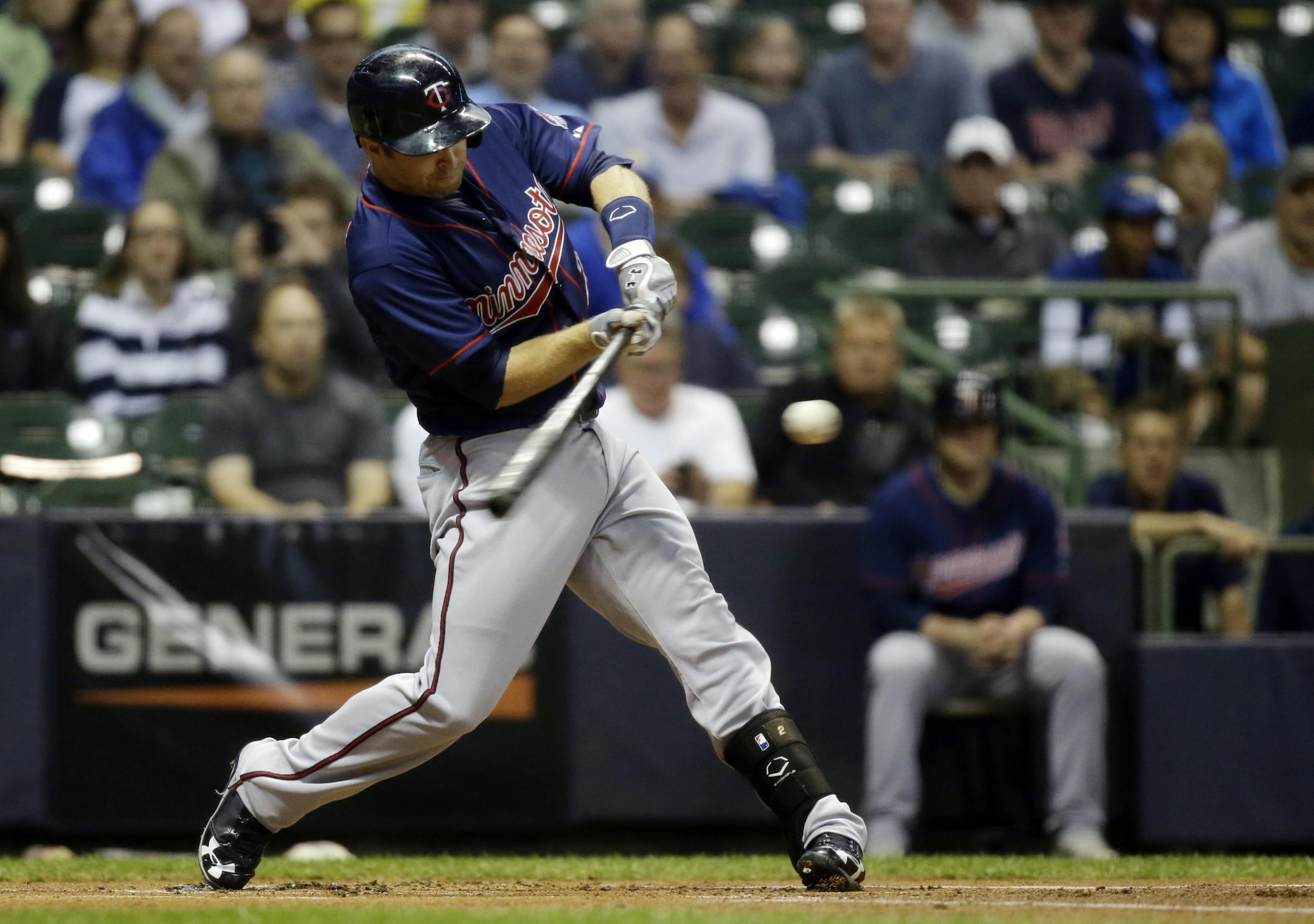 Brian Dozier hits during the first inning of a game against the Milwaukee Brewers