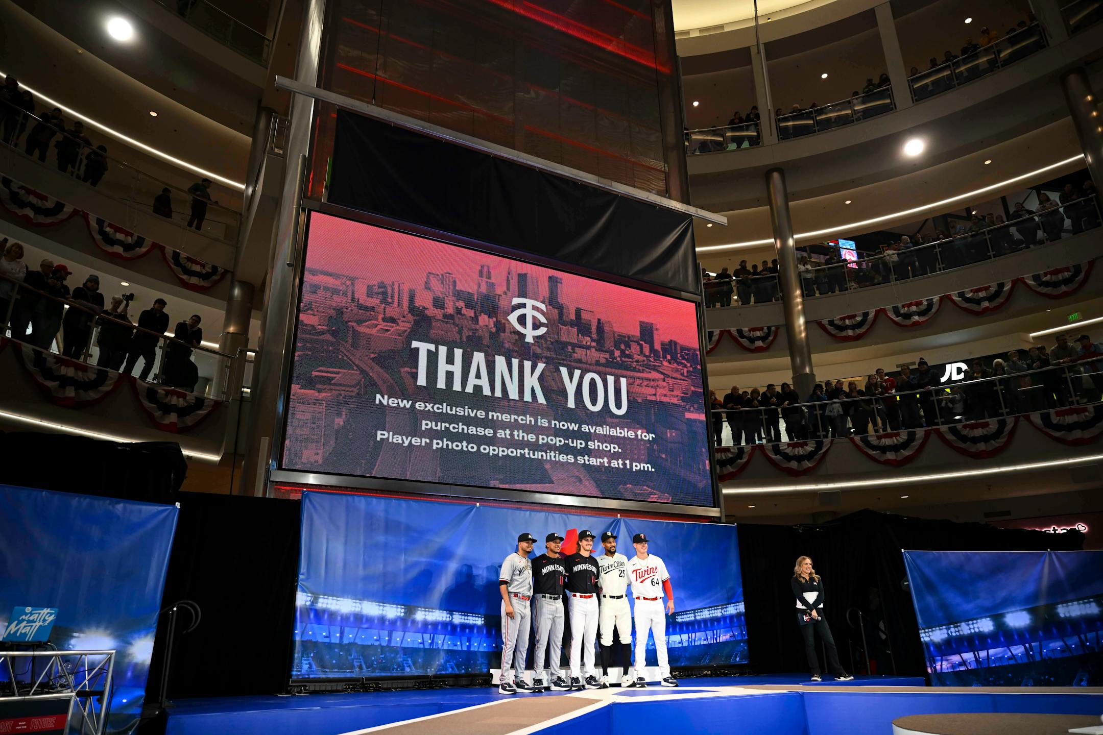 From left, Twins players Luis Arraez, Jorge Polanco, Joe Ryan, Byron Buxton and Jose Mirana pose for a photo in their new uniforms after a reveal.