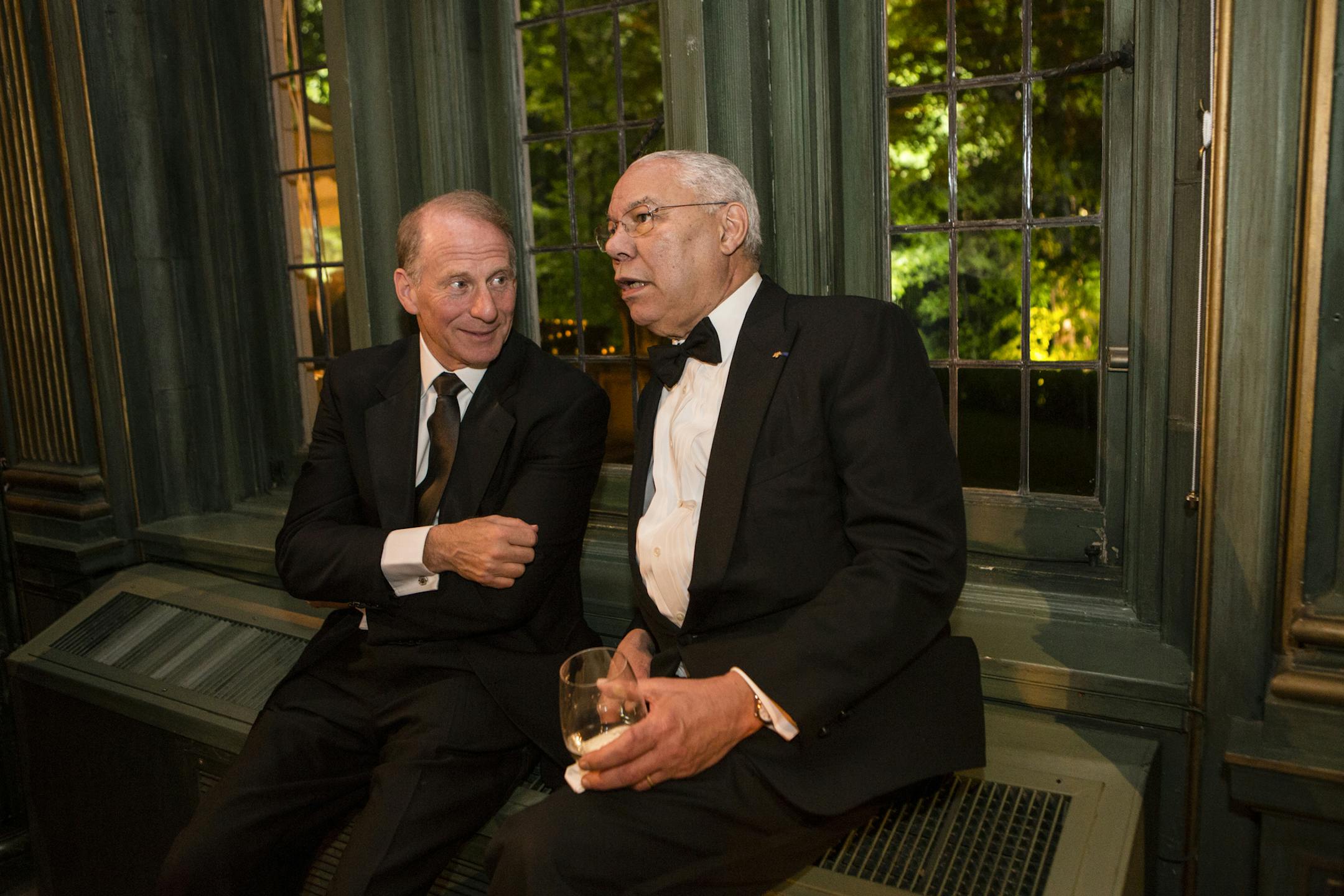 Former Secretary of State Colin Powell, right, at the Vanity Fair/Bloomberg White House Correspondents' Association dinner after-party at the residence of the French Ambassador in Washington, April 28, 2012. (Brendan Hoffman/The New York Times)