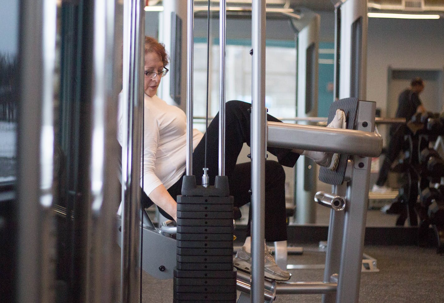 Elaine White, first member to use the new work out facility, works out Saturday afternoon. ] Elizabeth Brumley special to the Star Tribune * The revamped Palace Recreation Center officially openened Saturday.