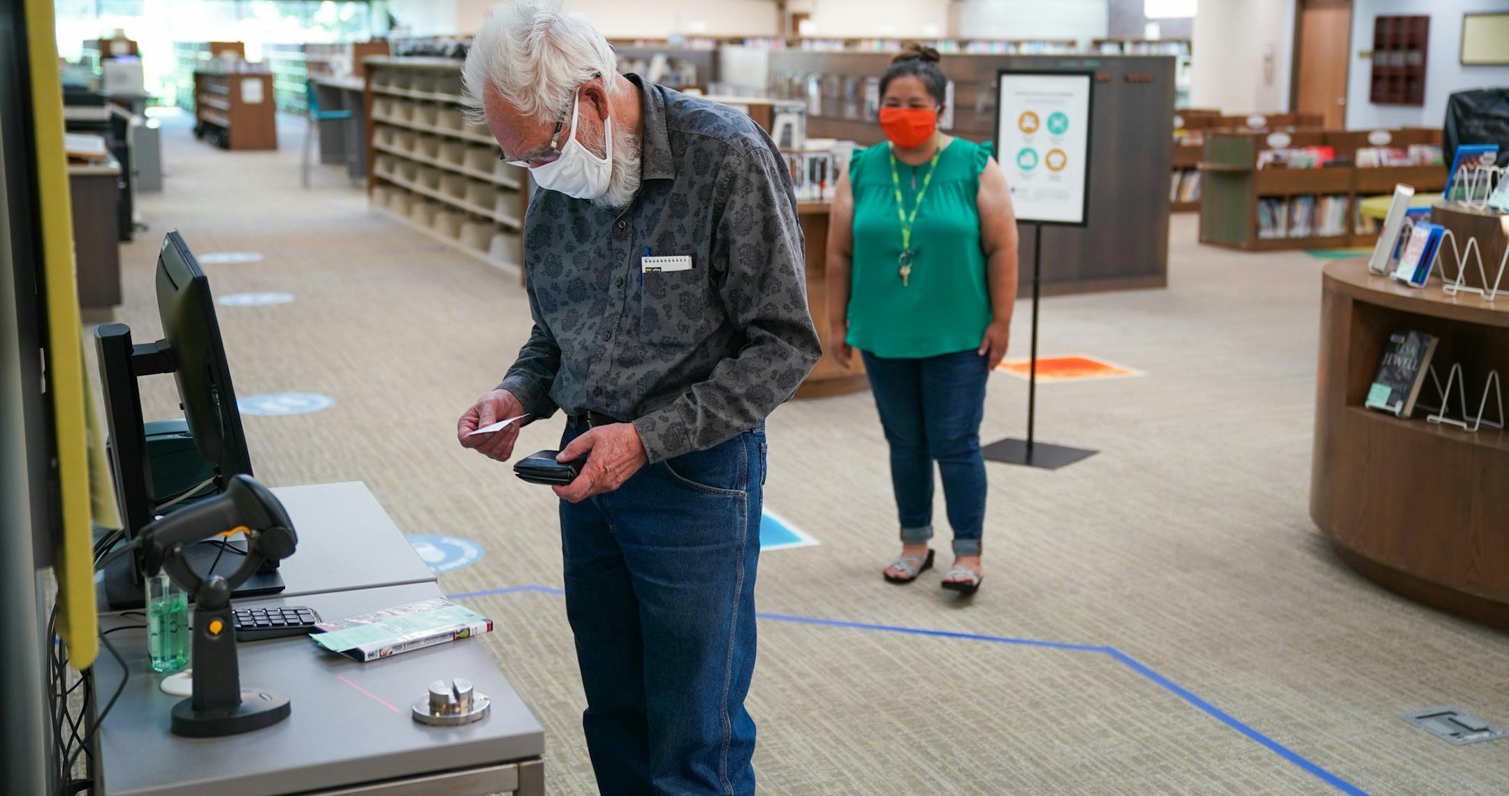A patron checked out a DVD at Sun Ray Library in St. Paul in September.