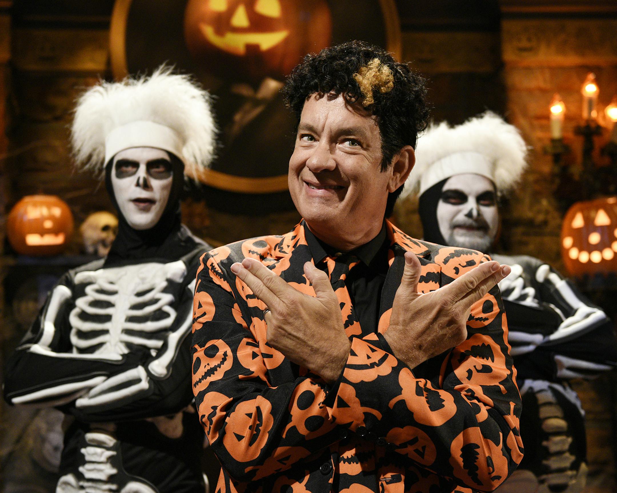 THE DAVID S. PUMPKINS ANIMATED HALLOWEEN SPECIAL -- Pictured: (l-r) Mikey Day as a skeleton dancer, Tom Hanks as David S. Pumpkins, Bobby Moynihan as a skeleton dancer -- (Photo by: Rosalind O'Connor/NBC) ORG XMIT: Season:2017