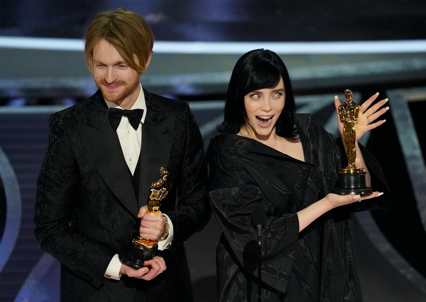 Billie Eilish, right, and Finneas O'Connell accept the award for best original song for "No Time To Die" from "No Time To Die" at the Oscars on Sunday, March 27, 2022, at the Dolby Theatre in Los Angeles. (AP Photo/Chris Pizzello)