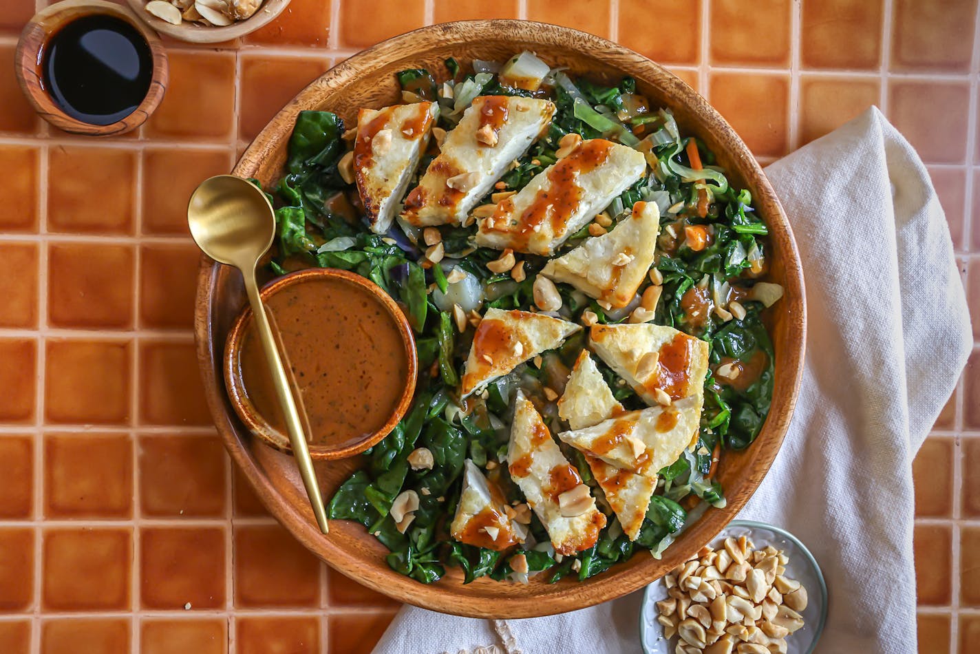 Pan-roasted Tofu with Dark Greens and Spicy Peanut Vinaigrette featuring fresh tofu.