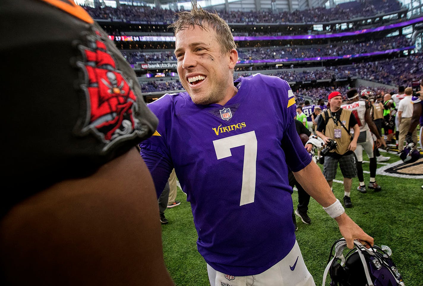 Minnesota Vikings quarterback Casey Keenum greeted players at the end of the game.