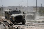 Israeli military vehicles maneuver during an operation in the West Bank city of Jenin, Friday, July 5, 2024. The Israeli military said Friday it was c
