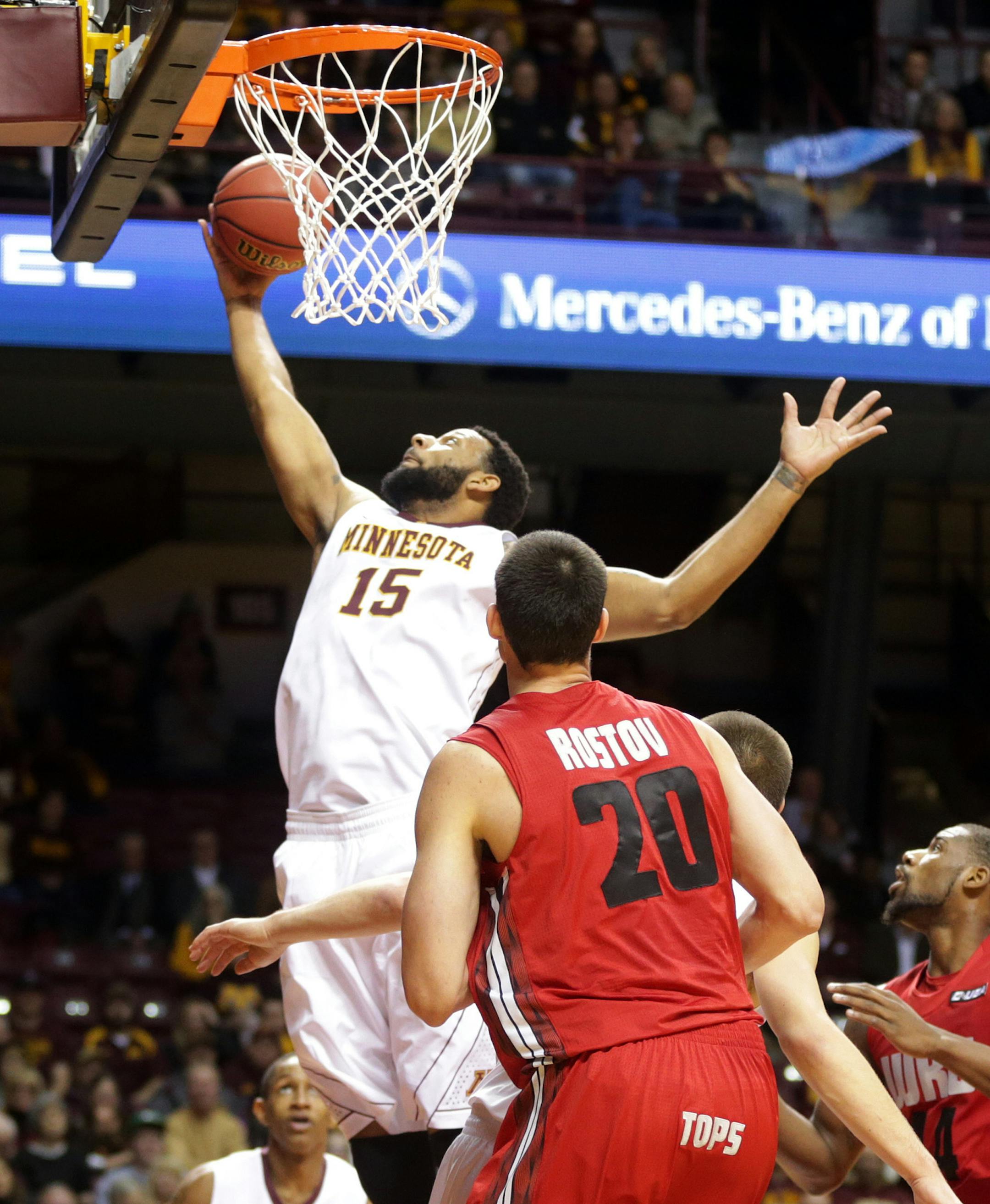 Minnesotaís Maurice Walker, left, pulls in a rebound as Western Kentuckyís Aleksej Rostov watches during the first half of an NCAA college basketball game Tuesday, Nov. 18, 2014, in Minneapolis. (AP Photo/Jim Mone) Mo Walker.