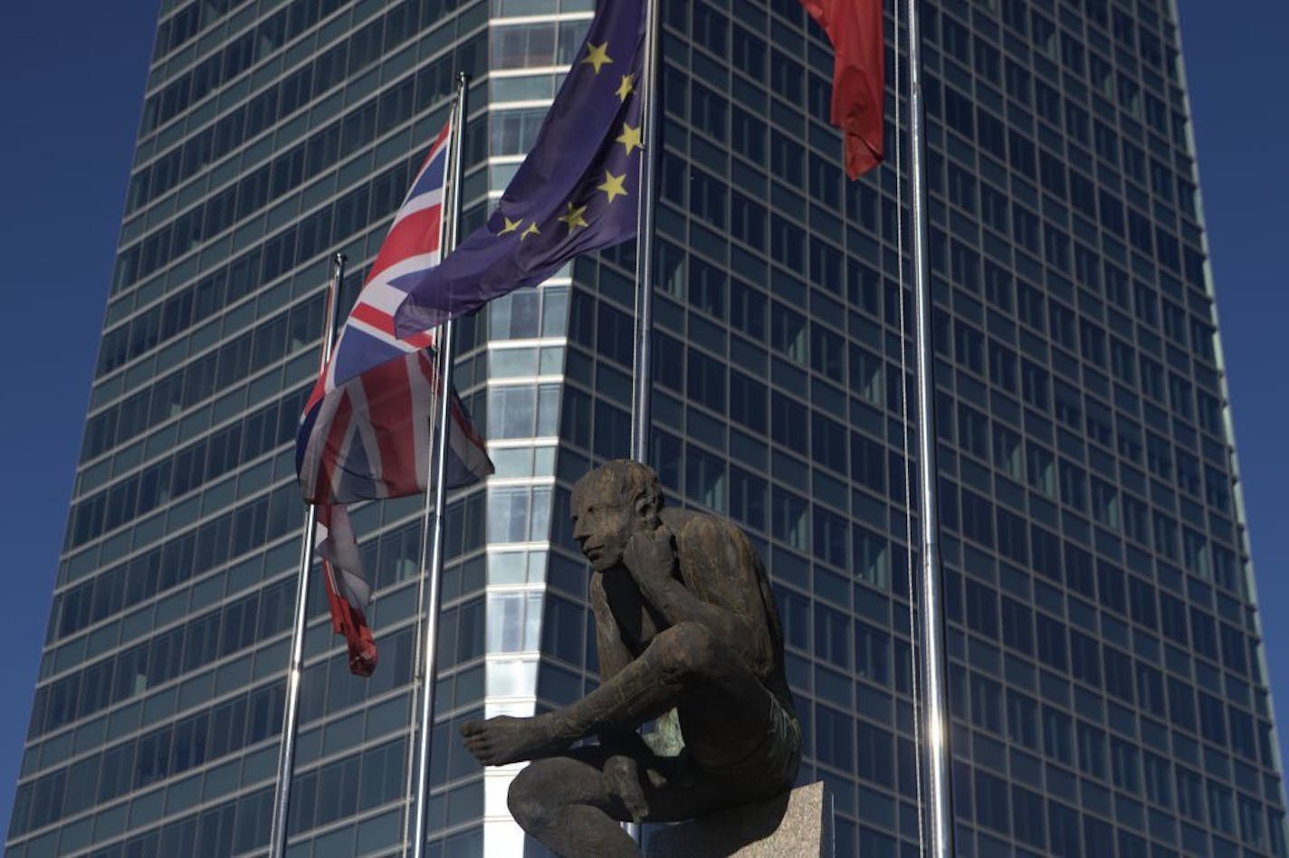 The British and EU flags fly together in the business district of Madrid, Spain, Tuesday, June 21, 2016. British voters head to the polls on Thursday to decide if the country should stay in the European Union or leave it.