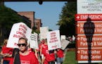Thousands of nurses walked around Abbott Northwestern on the first day of the strike Sunday June 19, 2016 in Minneapolis. Nurses were called back to w