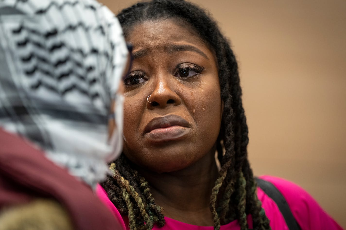 Council member Robin Wonsley sheds tears while speaking to community members calling for a cease-fire in Gaza after Minneapolis City Council's first meeting of 2024 in Minneapolis, Minn. Monday, Jan. 8, 2024. ] LEILA NAVIDI • leila.navidi@startribune.com