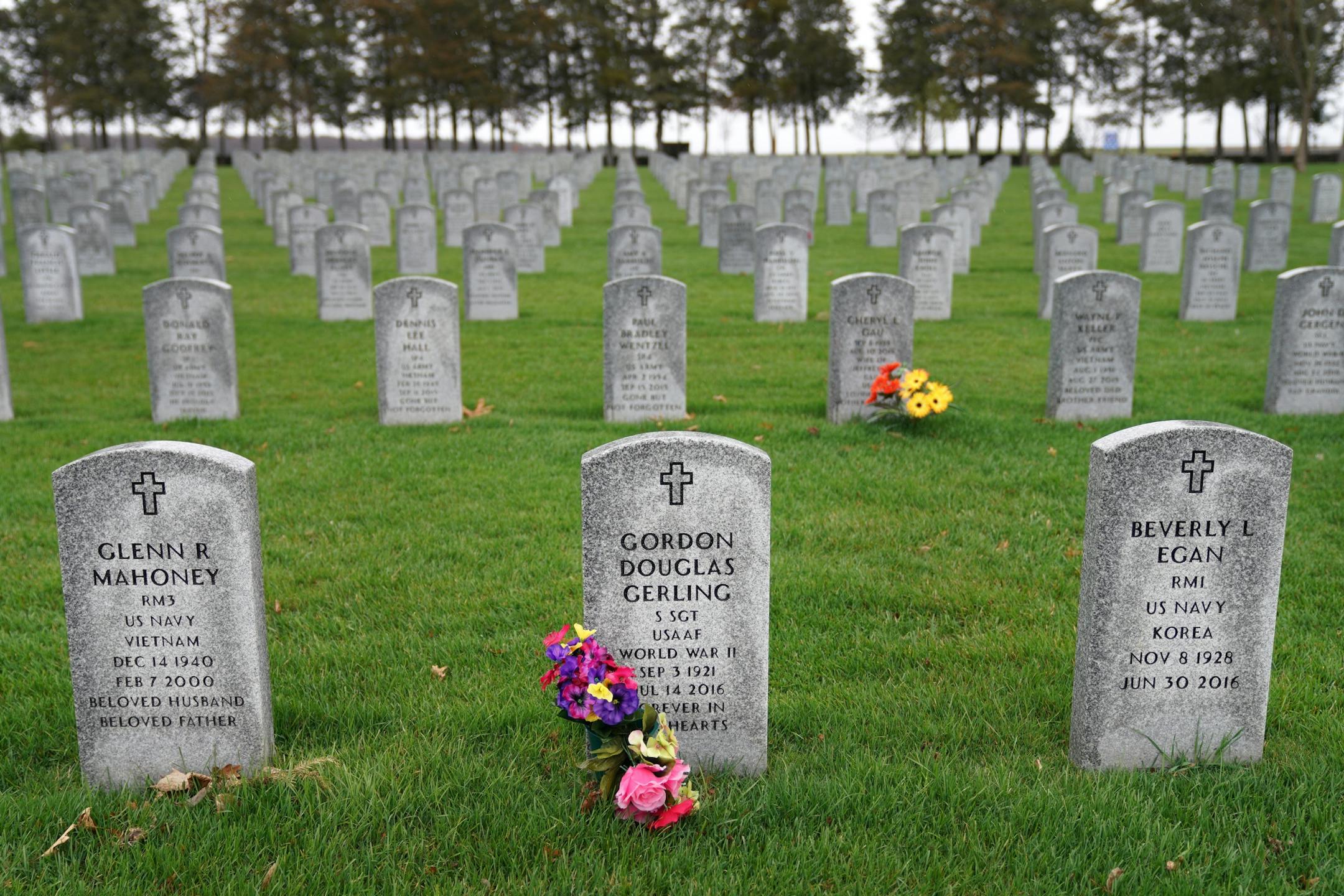 Flowers sat near a marker at the Minnesota State Veterans Cemetery for Gordon Gerling who masterminded the project.