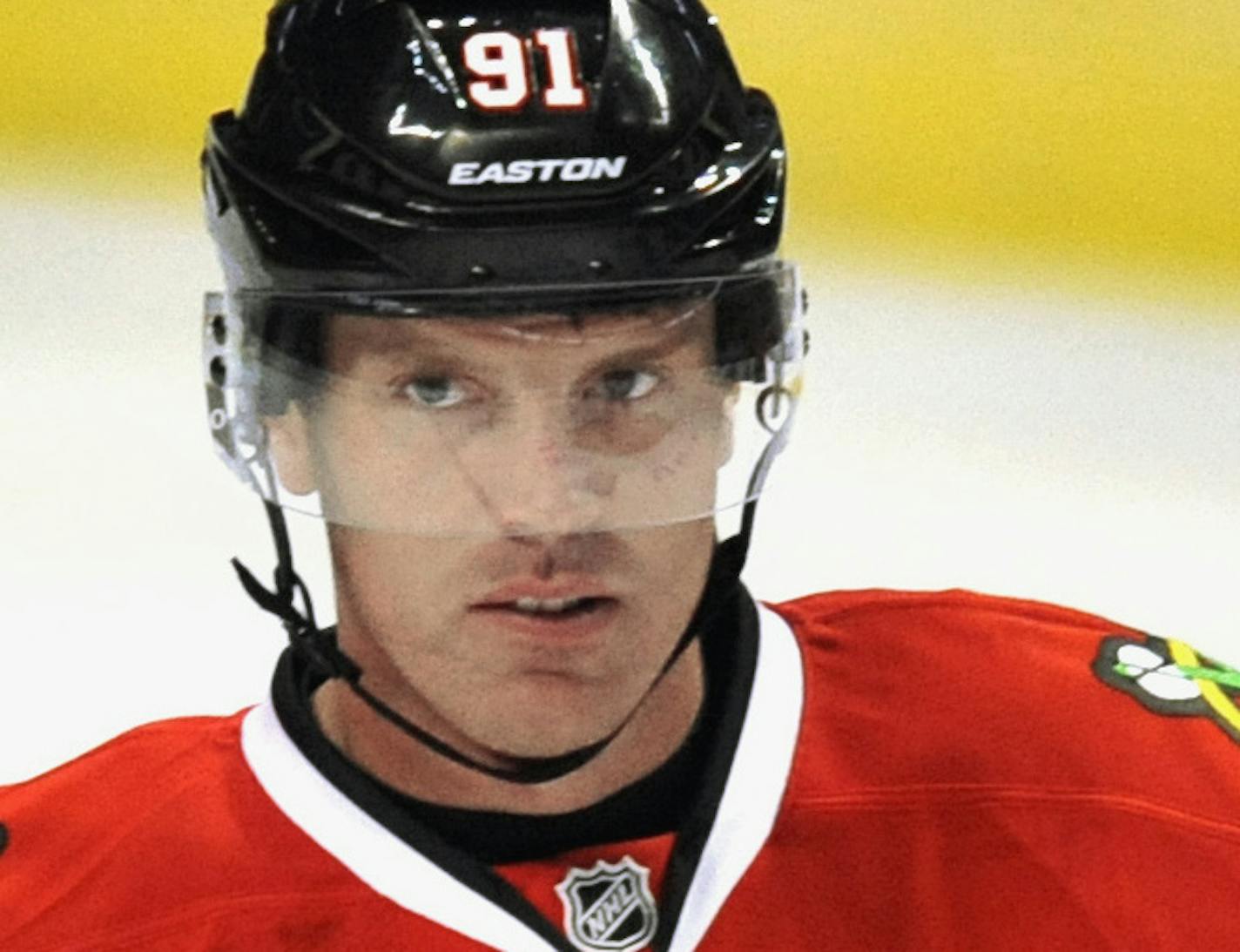 In this photo taken on Sept. 22, 2014, Chicago Blackhawks' Brad Richards skakes on the ice during a scrimmage at the team's hockey training camp festival in Chicago. Richards is on a long list of accomplished forwards getting used to new lines with NHL in the heart of its preseason. Richards is learning to play with Patrick Kane and Brandon Saad. Chemistry is the goal, and the process could play a big role in the success of their teams. (AP Photo/Paul Beaty) ORG XMIT: CX803