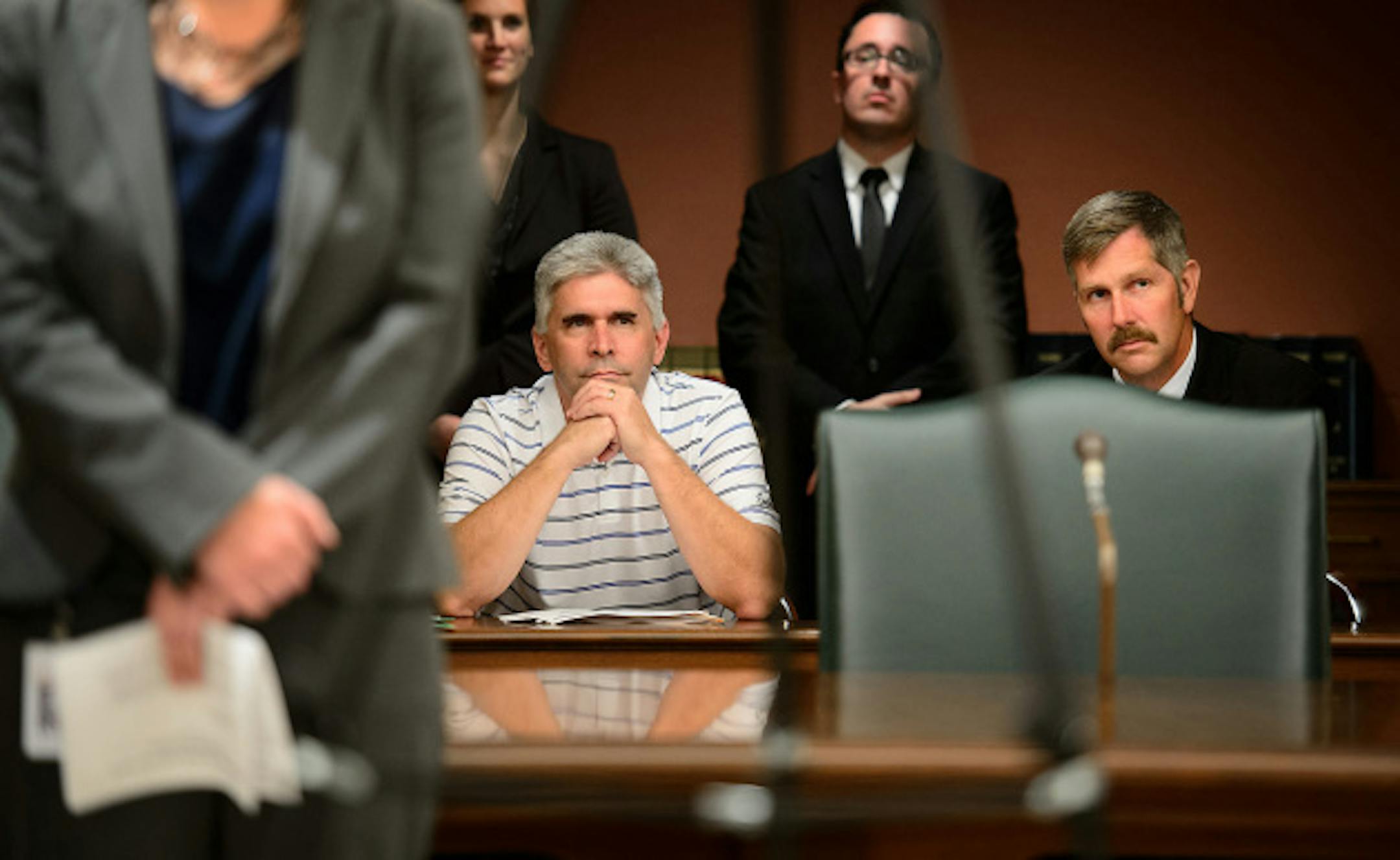 State Rep. Joe Atkins (DFL – Inver Grove Heights) and State Sen. Tony Lourey (DFL – Kerrick) listened as Commerce Commissioner Mike Rothman talked about the insurance rates.  Atkins and Lourey are both bill authors of legislation to create Minnesota's health insurance exchange.  The Commerce Department announced that rates for insurance companies selling plans on the new MNsure exchange, which launches Oct. 1 are the lowest average for in the country,  Friday, September 6, 2013       ]   GLEN STUBBE * gstubbe@startribune.com