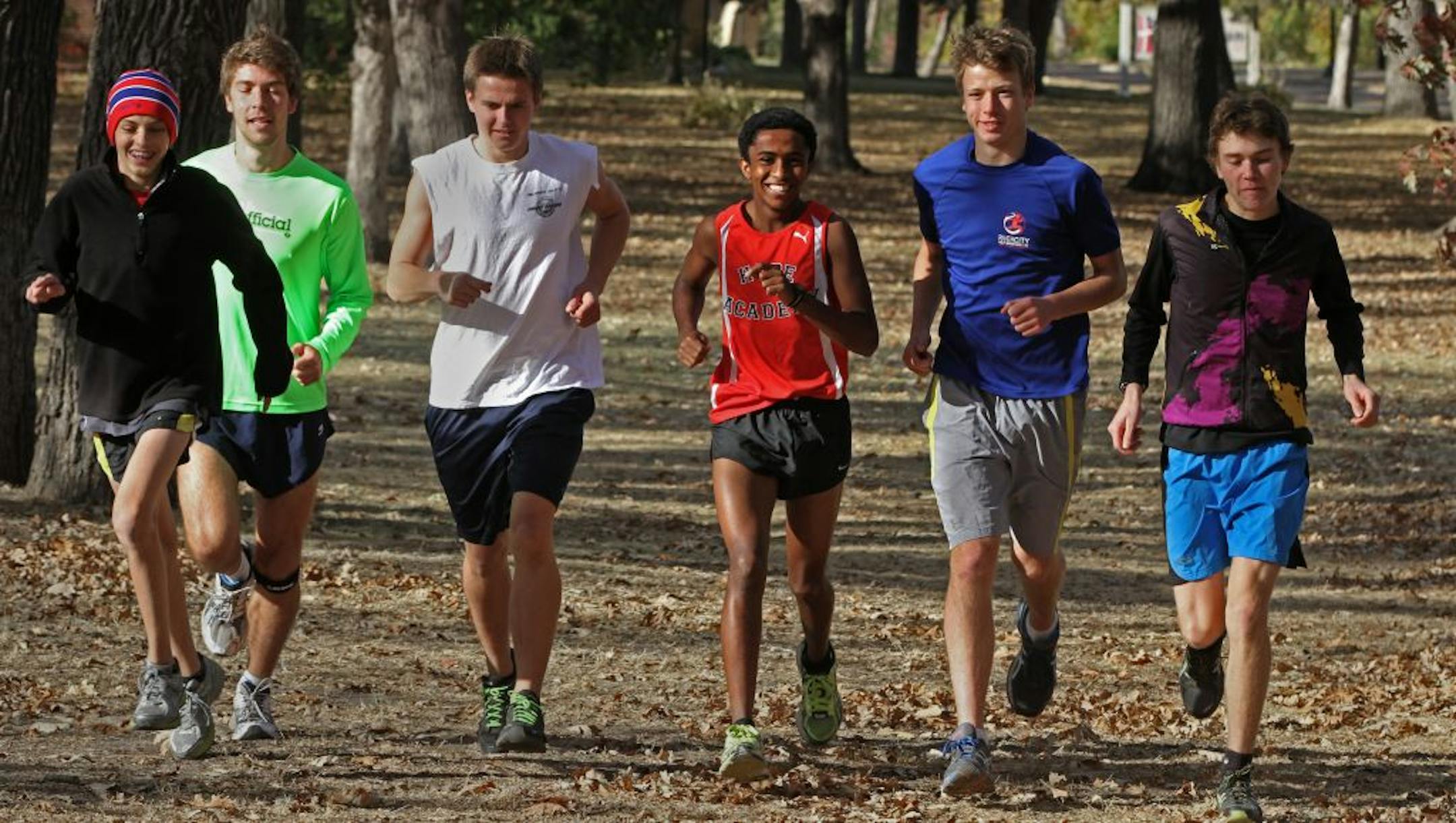 Ephraim Bird, in the red jersey, ran with the Minnehaha Academy cross-country team recently. Bird, a 5-4, 105-pound sophomore, does not attend the school. Adopted from Ethiopia when he was 13, he attends tiny Hope Academy in Minneapolis, which does not have a cross-country team.