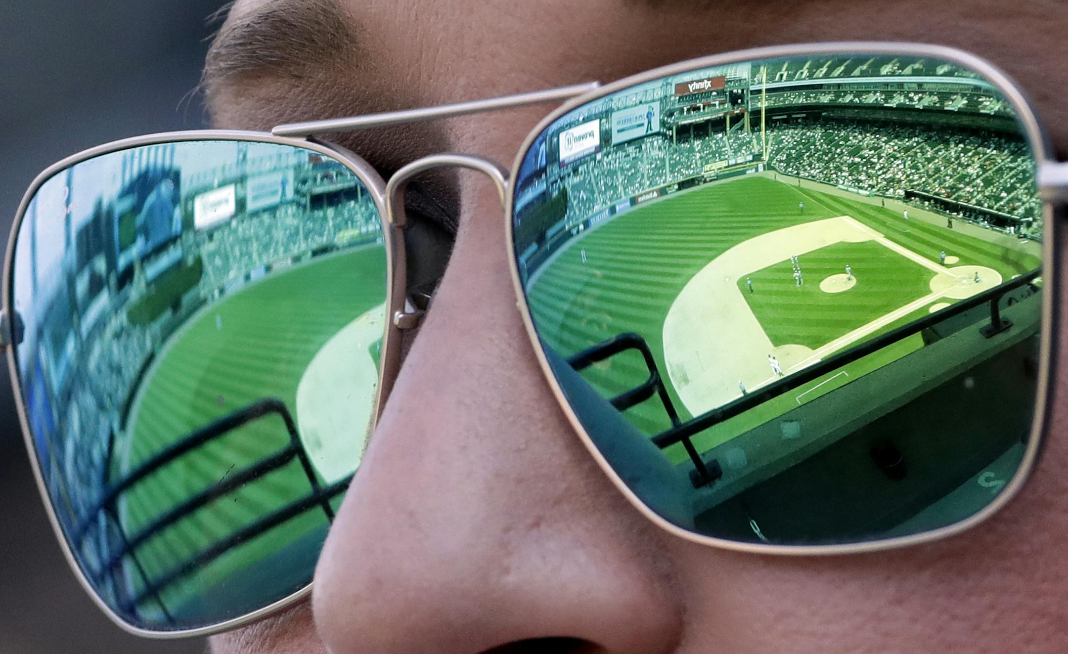 Courtney Wheaton watches a baseball game between the Detroit Tigers and the Chicago White Sox in Chicago, Sunday, June 17, 2018. (AP Photo/Nam Y. Huh) ORG XMIT: MIN2018062519383741