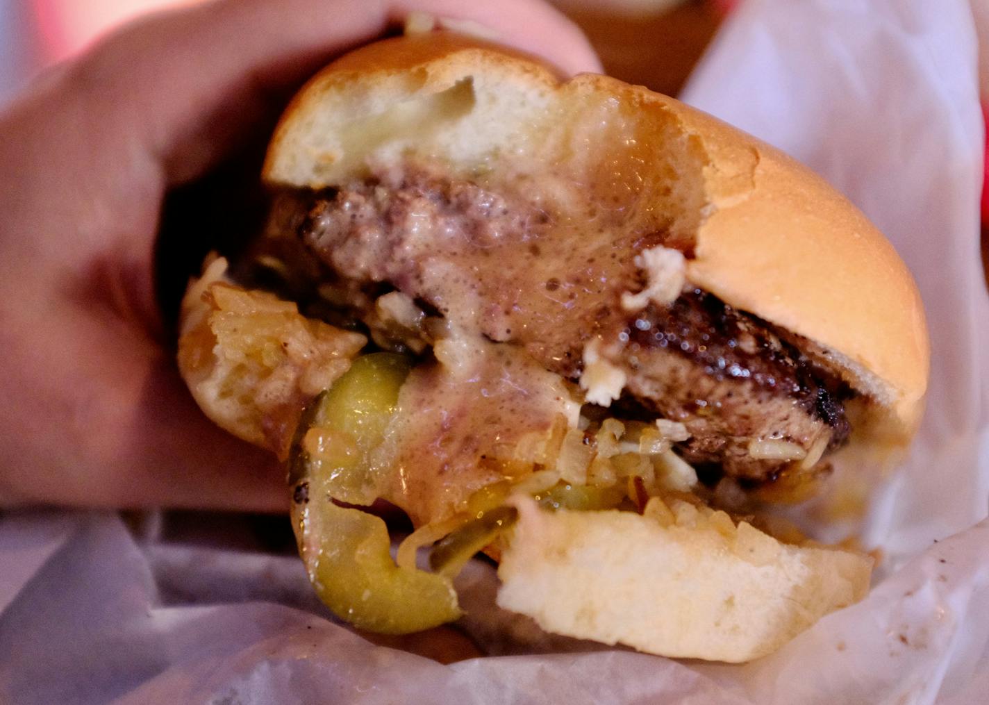 Molten cheese and fat ooze from a Jucy Lucy burger at Matt's Bar in south Minneapolis.