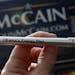 A tire pressure gauge distributed by John McCain's campaign: Rather than researched plans of their own, Republicans offer trivial attacks.